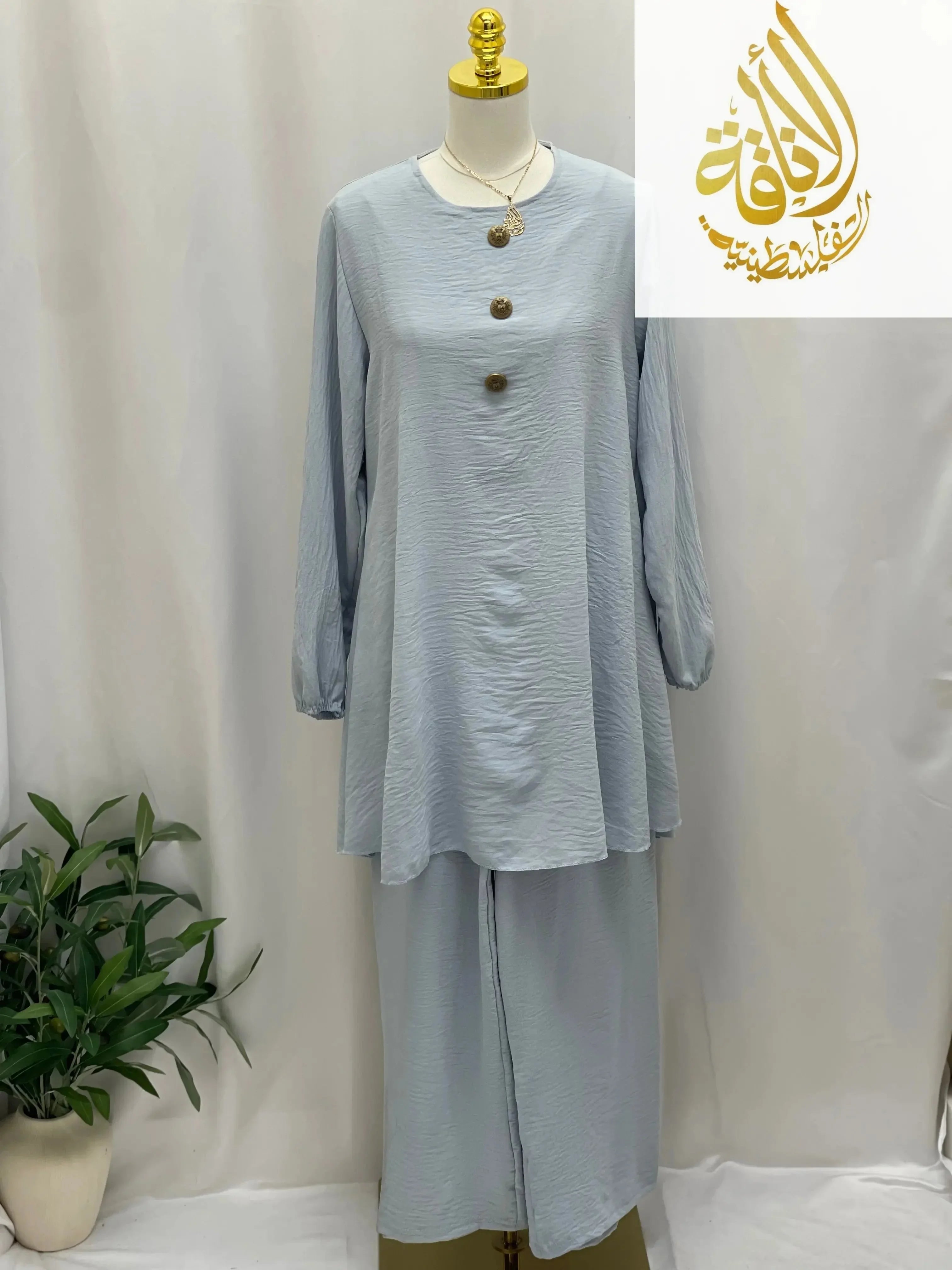 Palestinian Elegance modest long tunic and pant set in light blue casual fabric with button details