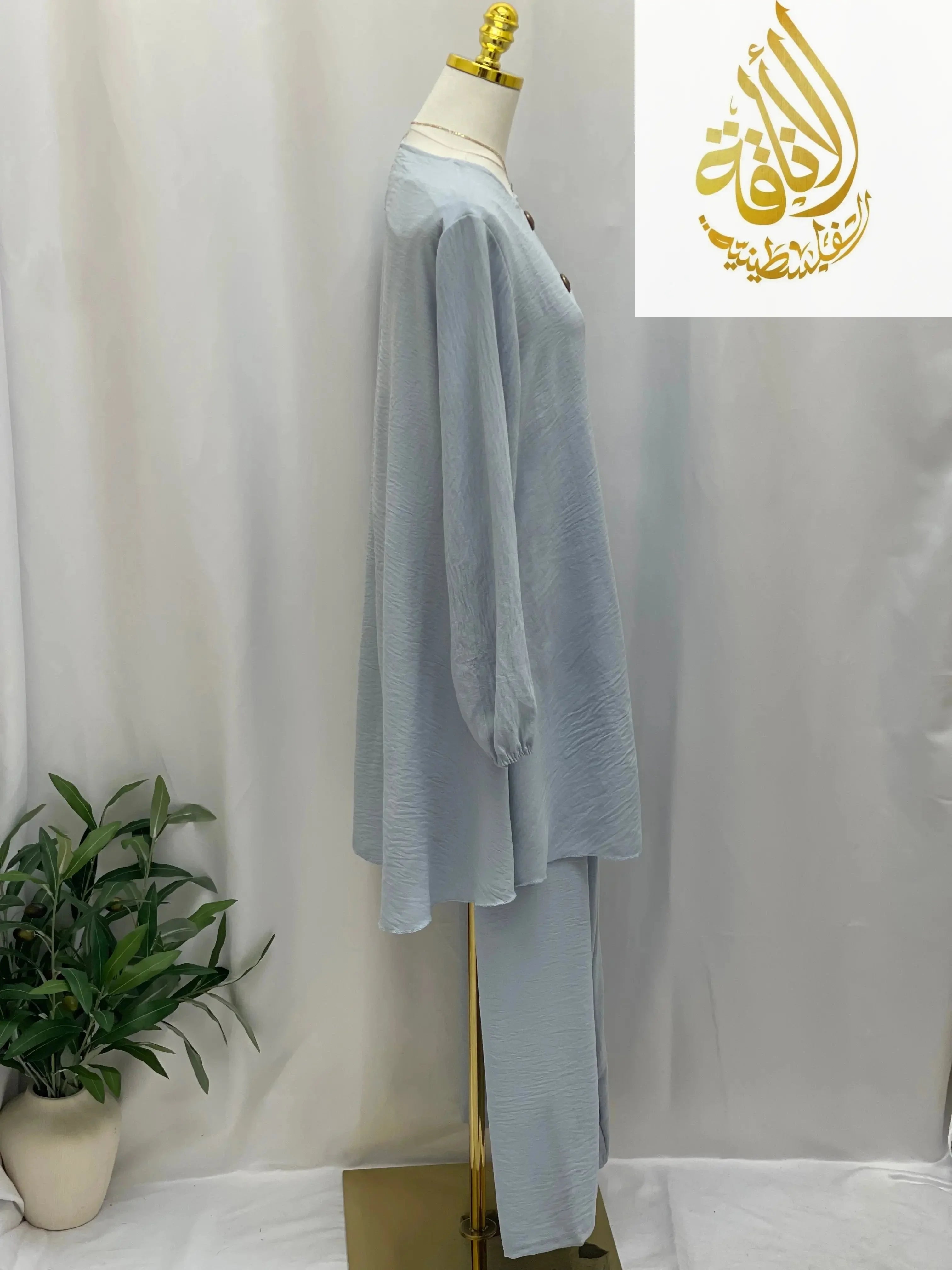 Palestinian Elegance modest long tunic and pant set in light blue casual fabric on mannequin