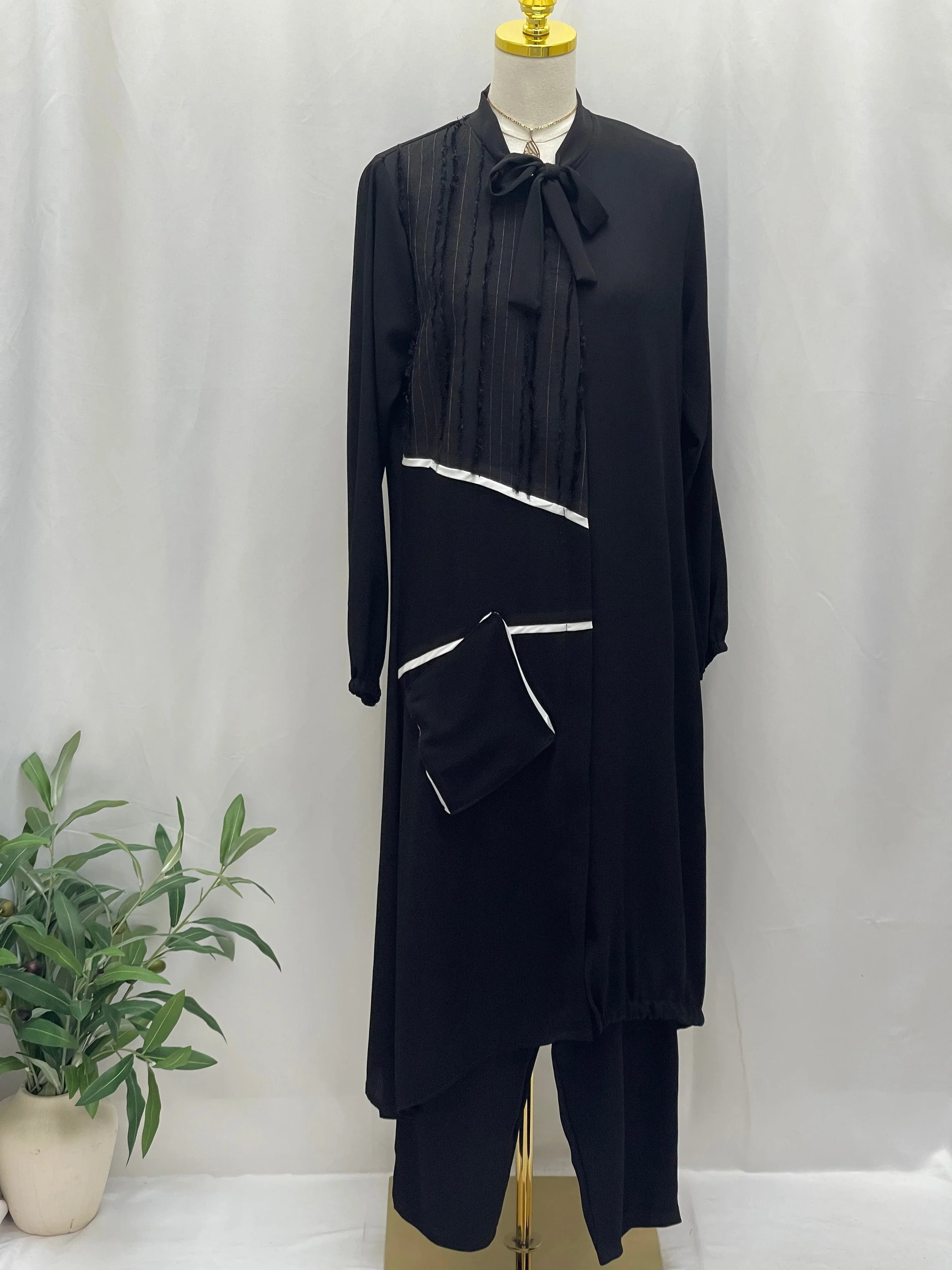 Palestinian Elegance black Modesty Long Set featuring long tunic with bow neck white trim and matching pants