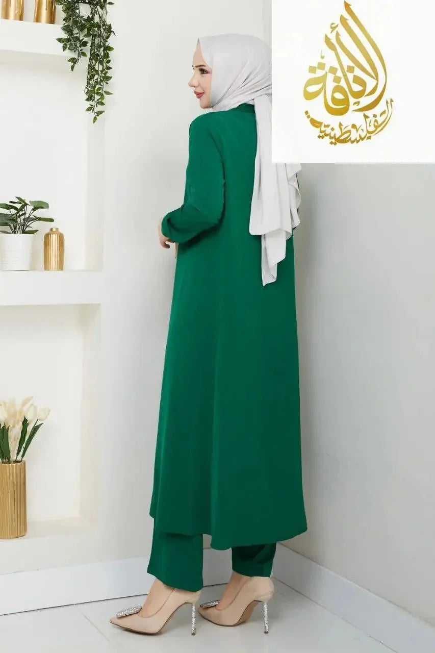 Palestinian Elegance modesty long set in green featuring a long tunic and matching pants worn with a white hijab