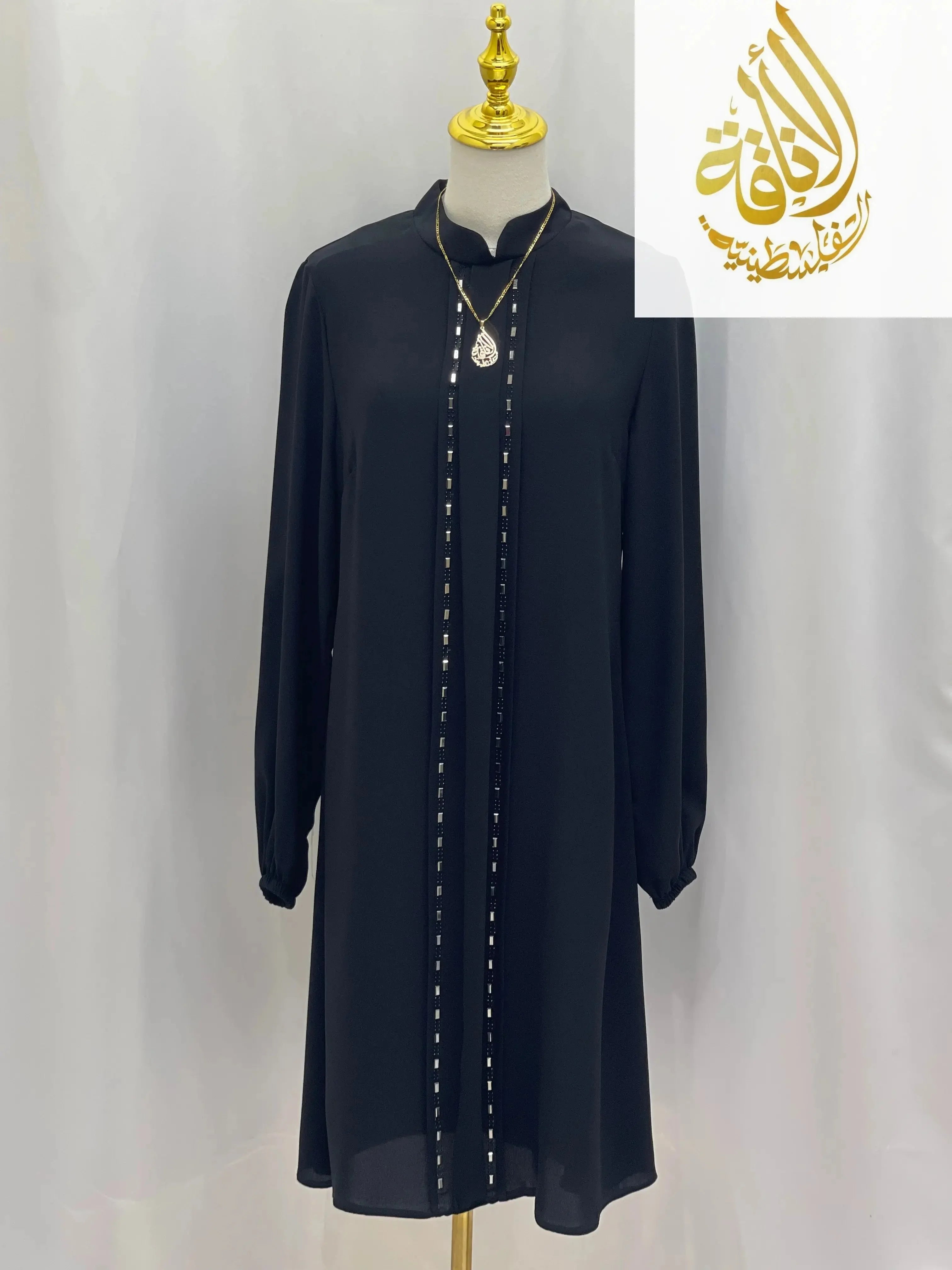 Palestinian Elegance modest embroidered tunic dress in black with long sleeves and decorative vertical embroidery