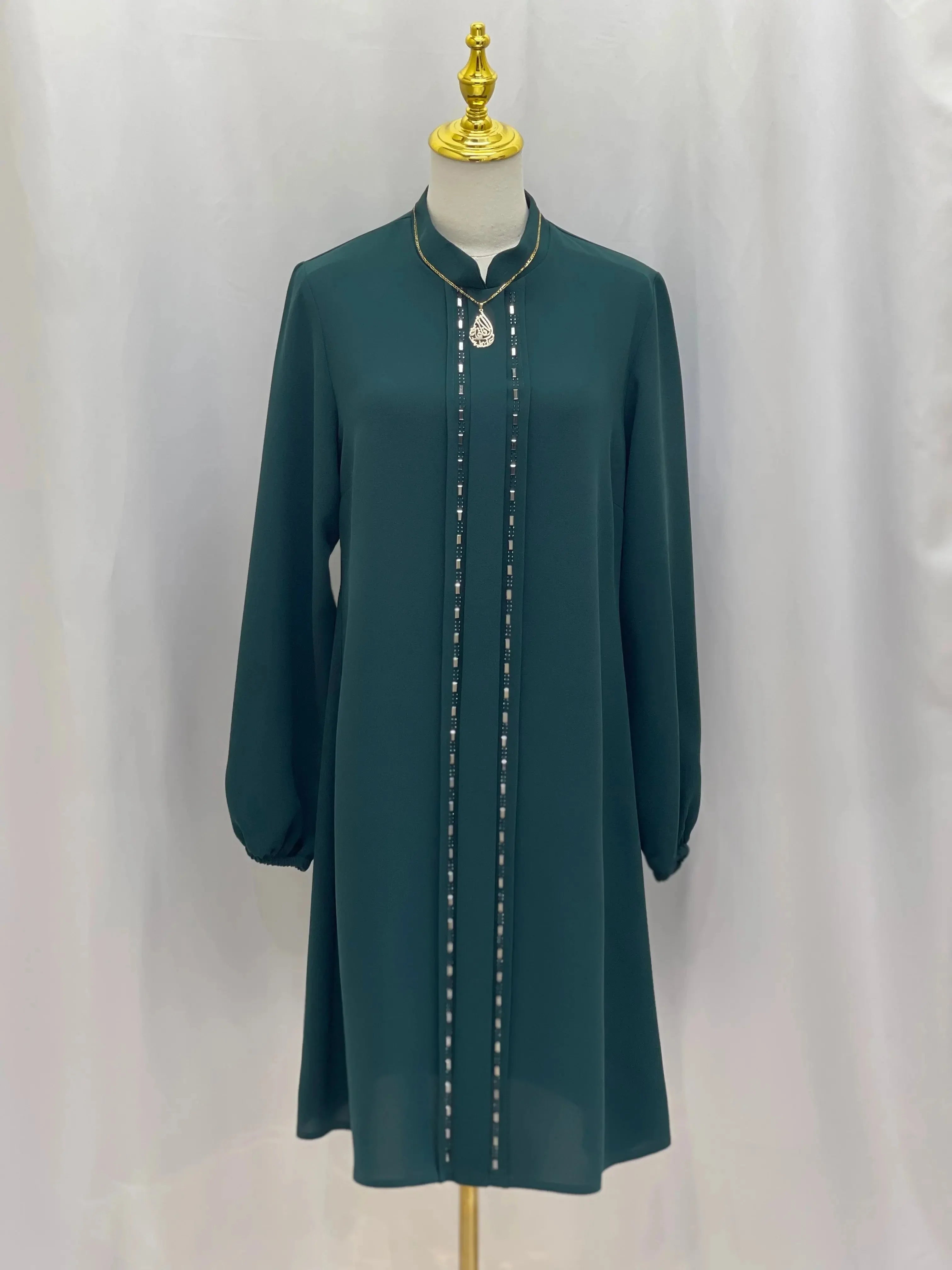 Palestinian Elegance modest embroidered tunic dress in dark green with long sleeves and detailed front embroidery