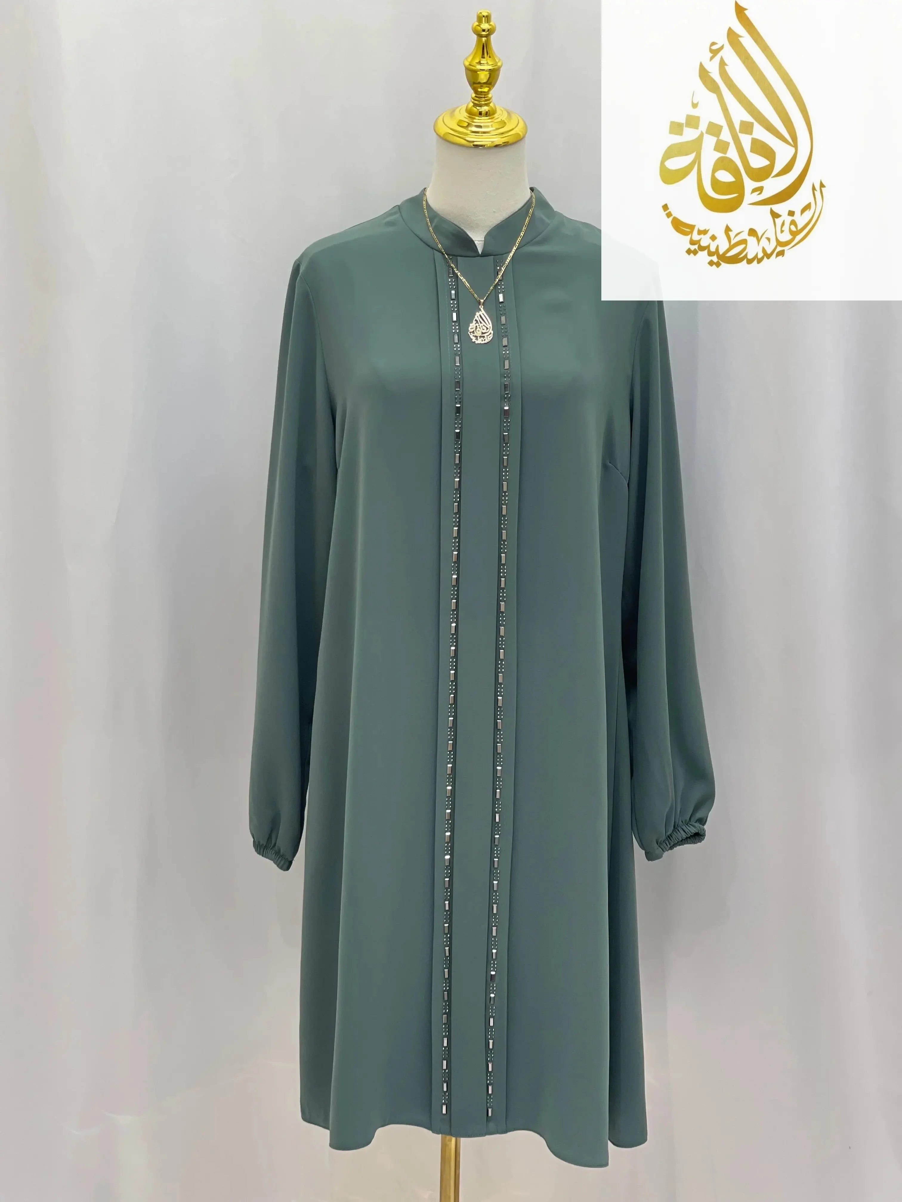 Palestinian Elegance modest embroidered tunic dress in muted green with long sleeves and decorative vertical embroidery