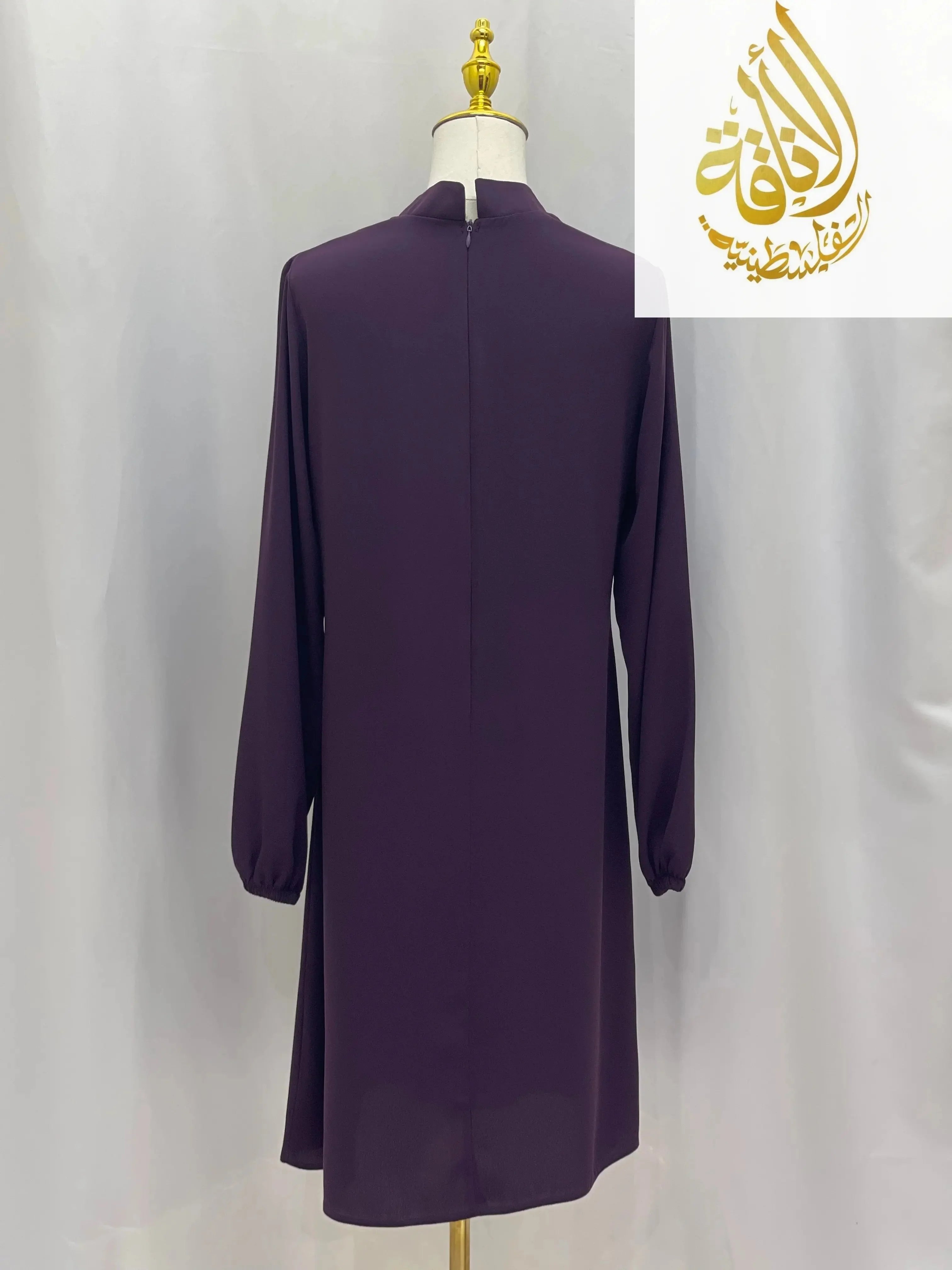 Back view of modest embroidered tunic dress in deep purple with long sleeves by Palestinian Elegance