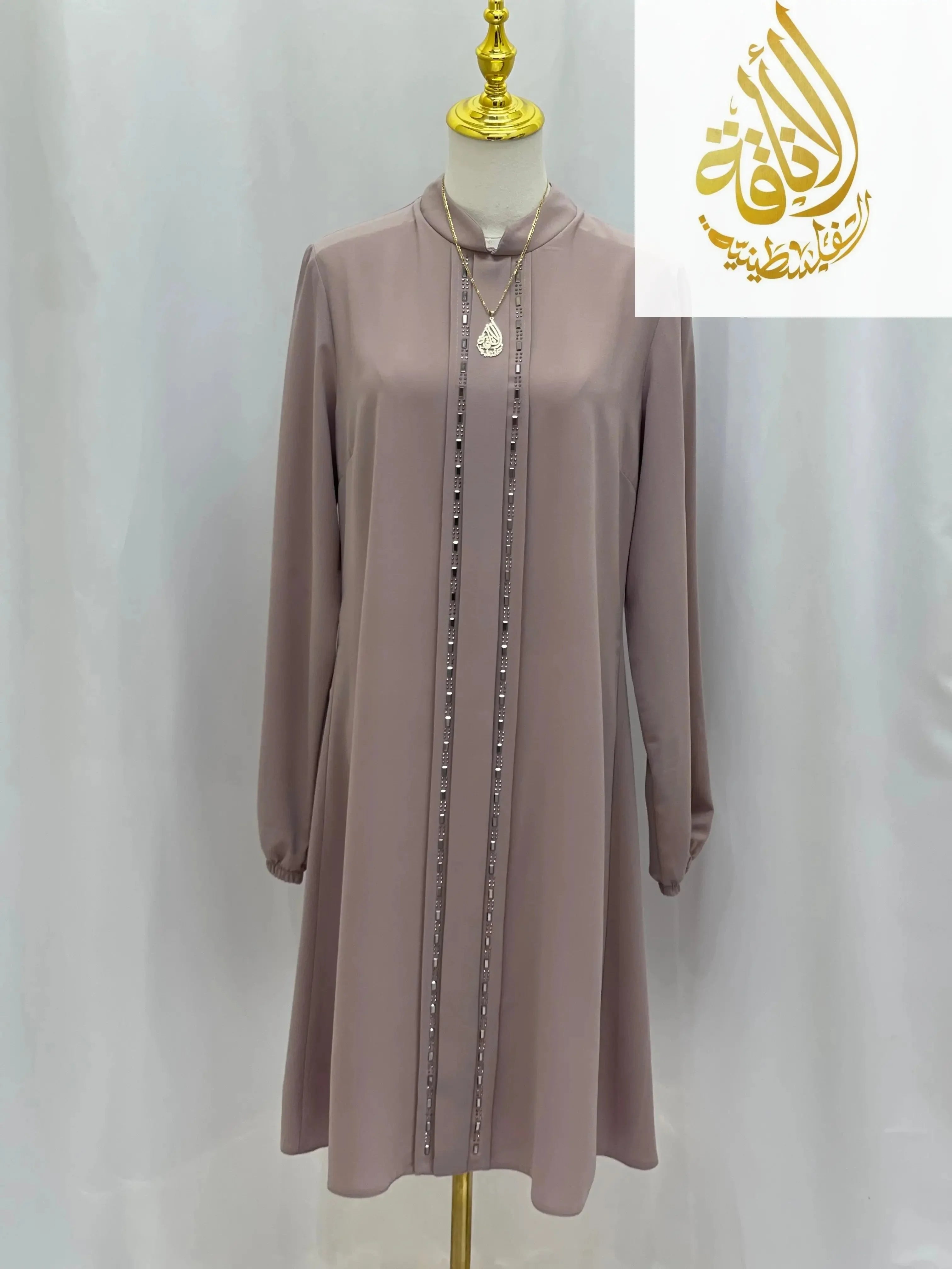 Palestinian Elegance modest embroidered tunic dress in light mauve with long sleeves and decorative front detail
