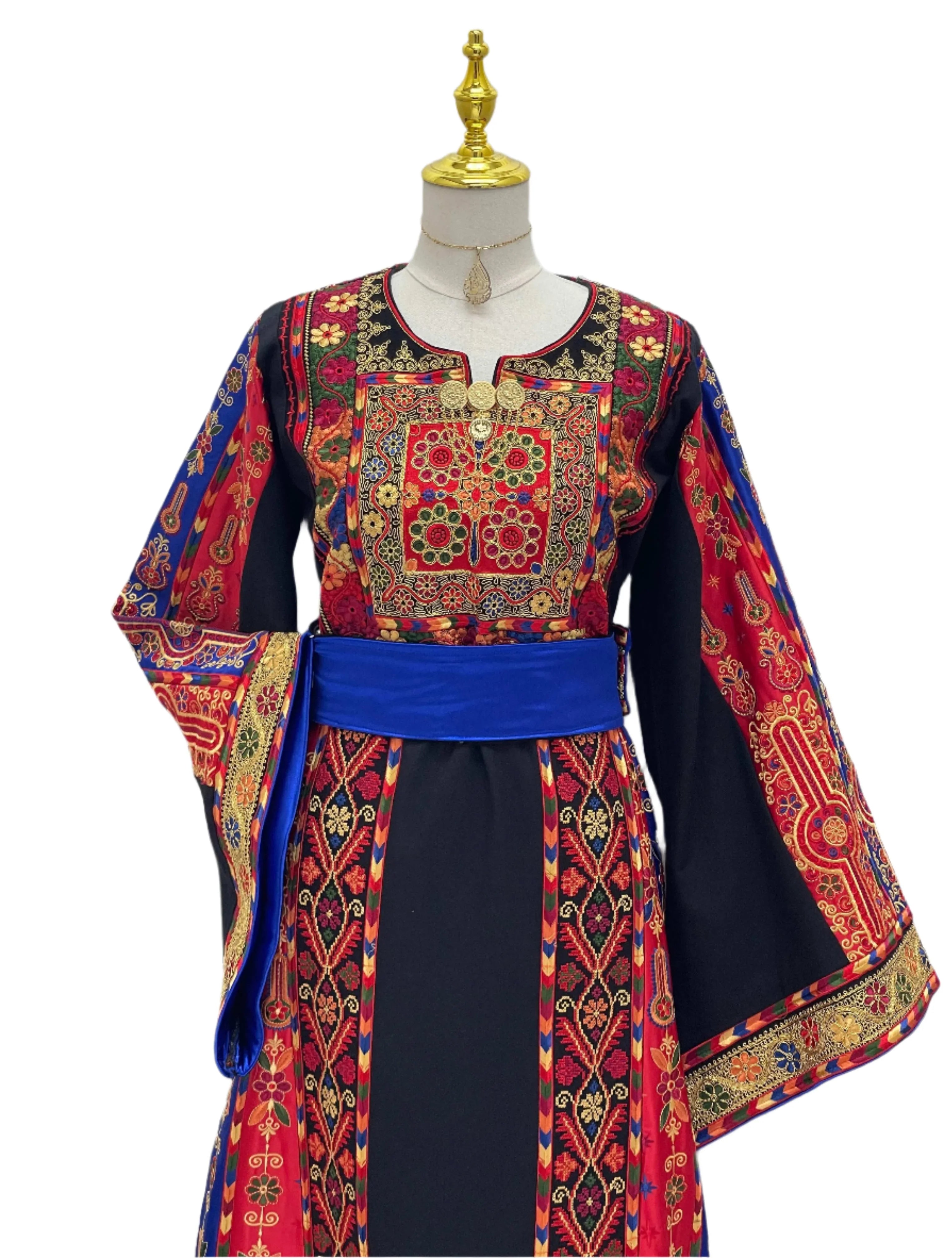 Mona Soft Atmeen Thoub Kasab Embroidery traditional embroidered dress with vibrant red and blue patterns