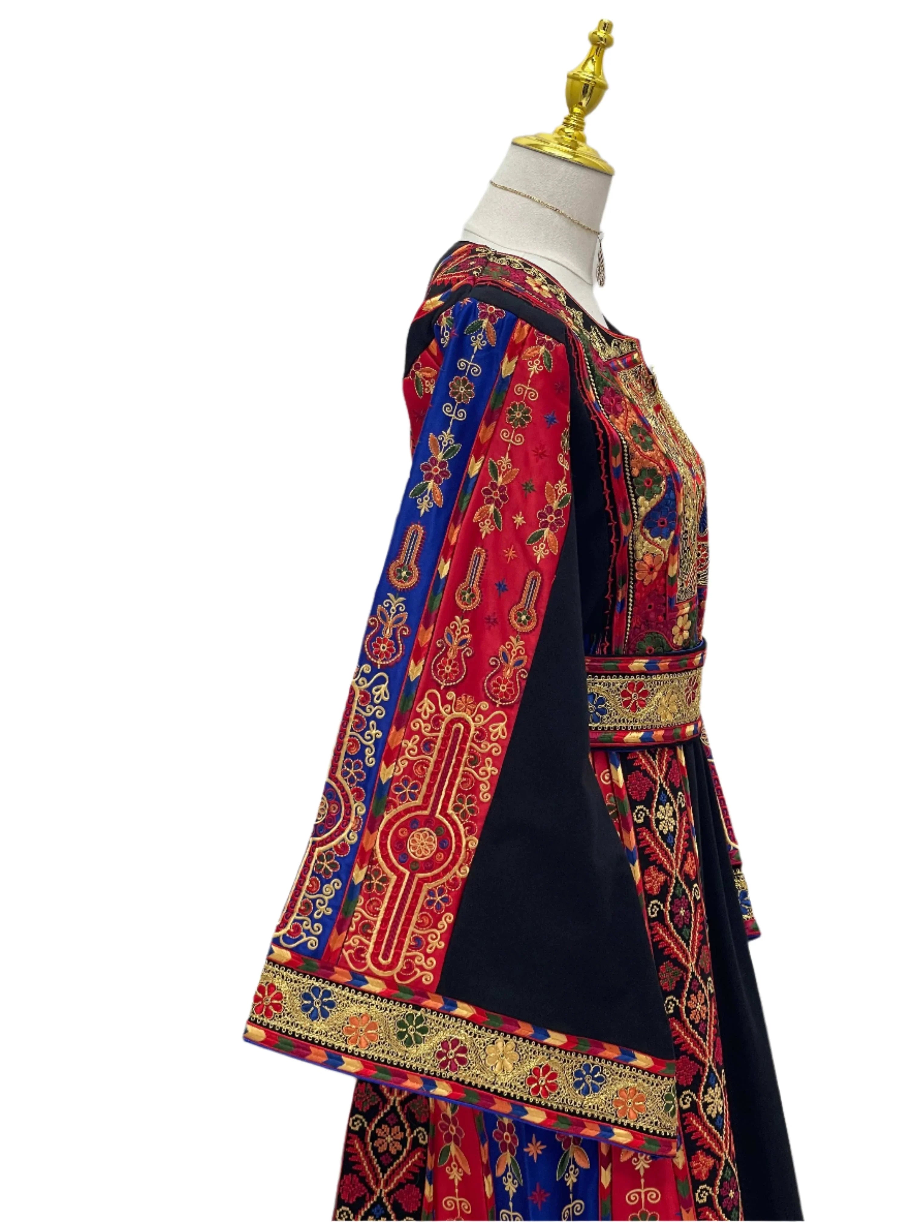 Mona Soft Atmeen Thoub Kasab Embroidery traditional Palestinian dress with intricate red blue and gold embroidery