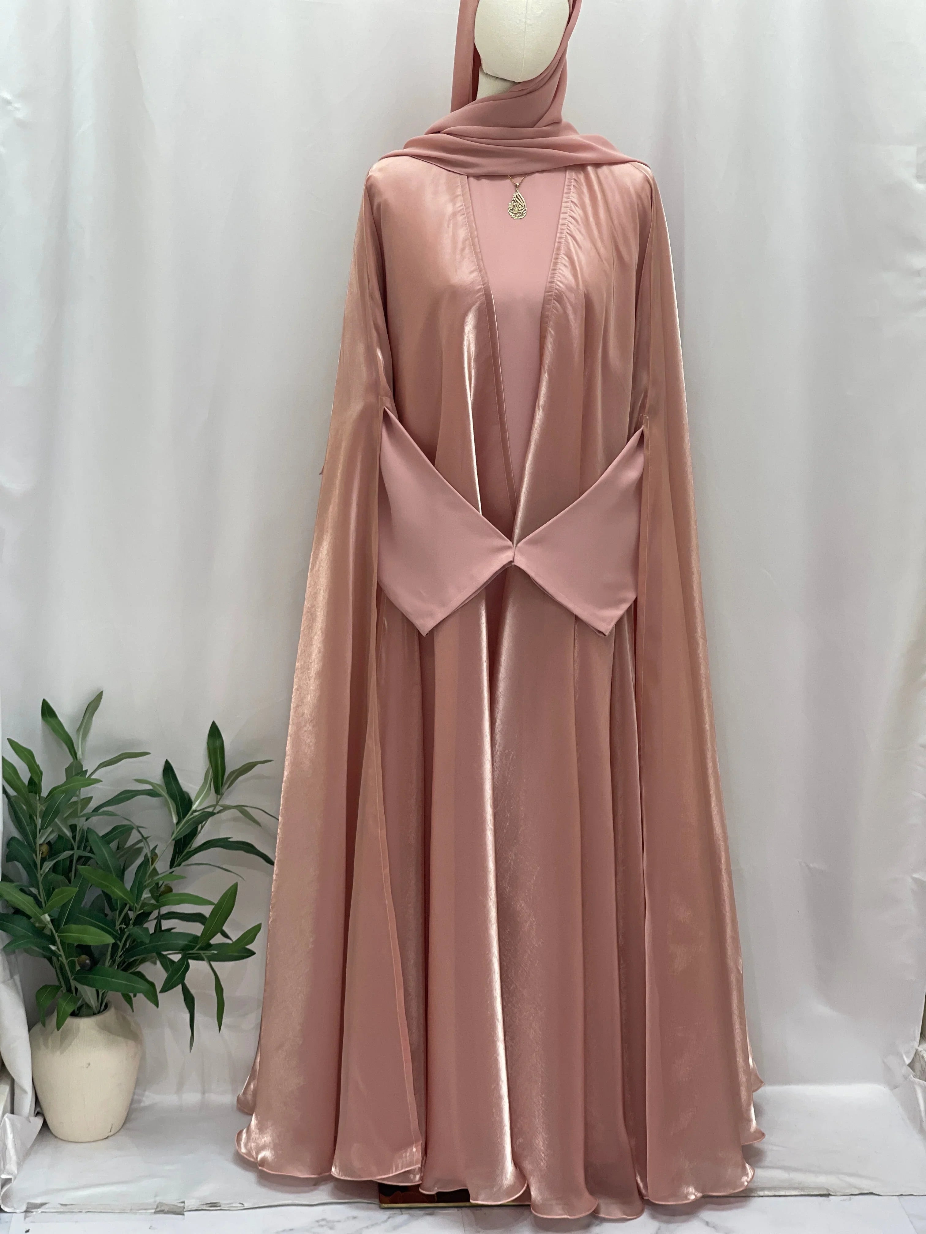 Palestinian Elegance Moonlit Organza Abaya in soft pink satin fabric with flowy design and unique waist detail