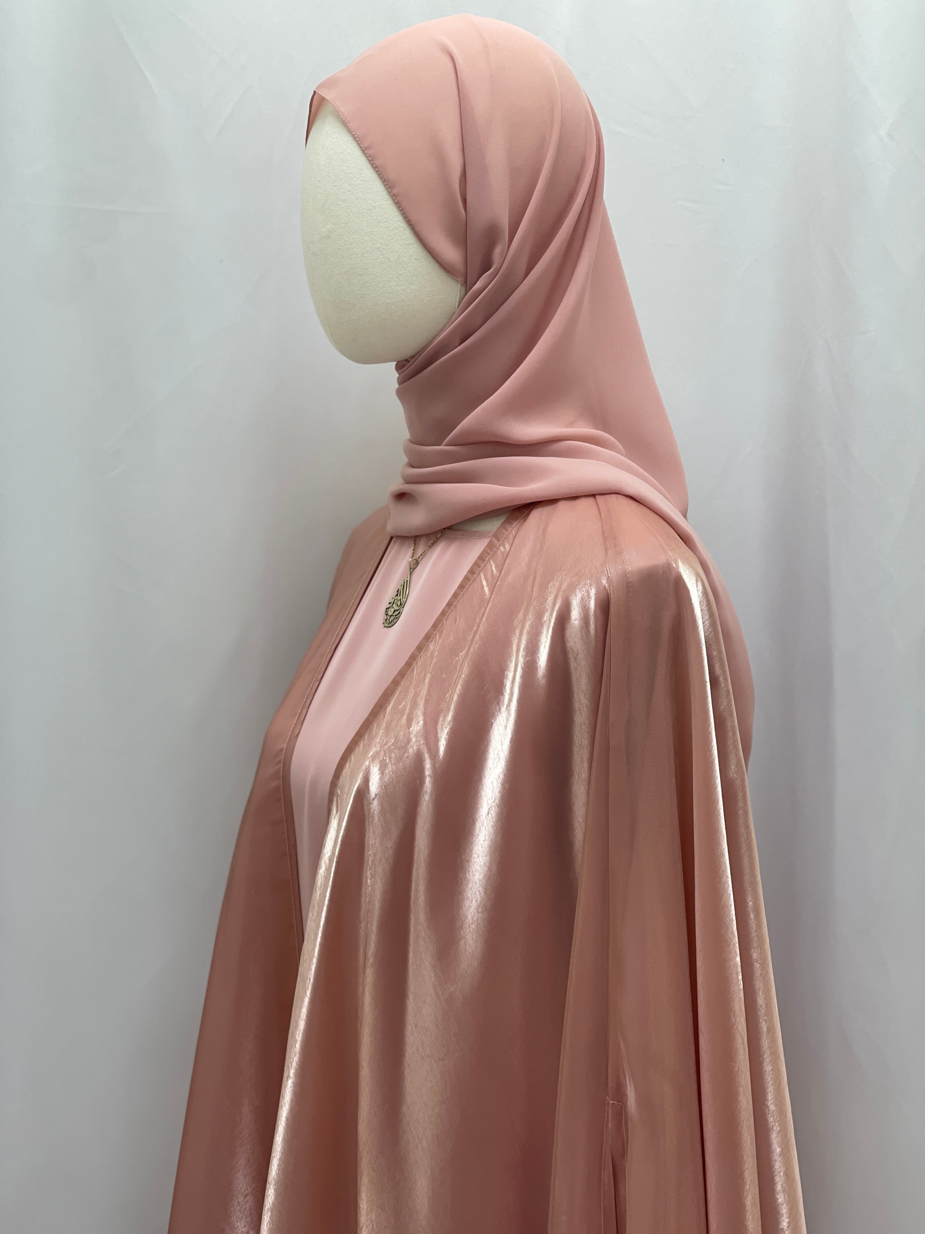 Moonlit Organza Abaya by Palestinian Elegance in soft pink with shiny fabric and matching hijab