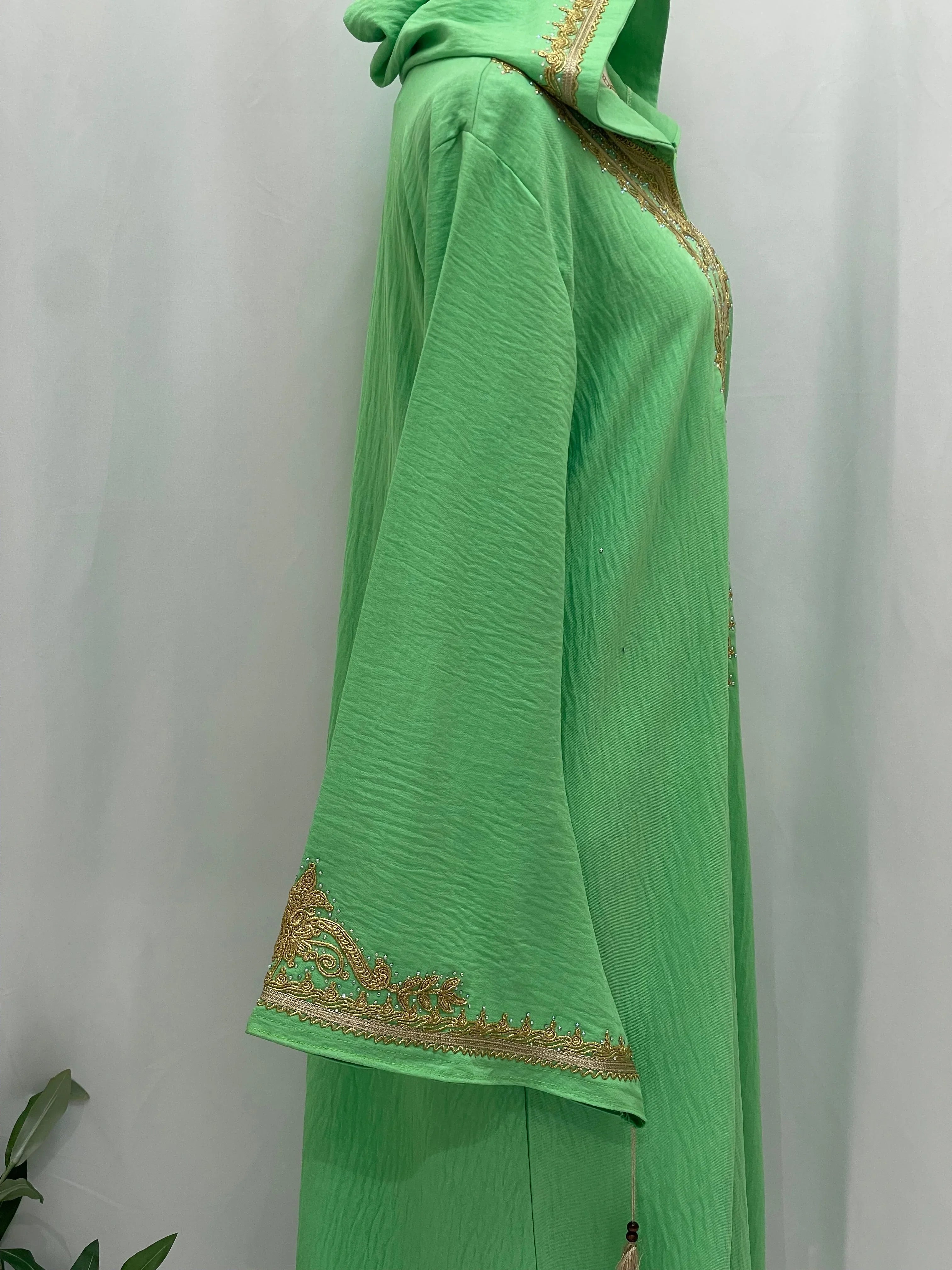 Palestinian Elegance Moroccan Embroidered Djellaba green hooded abaya side view with gold embroidery on cuff and neckline