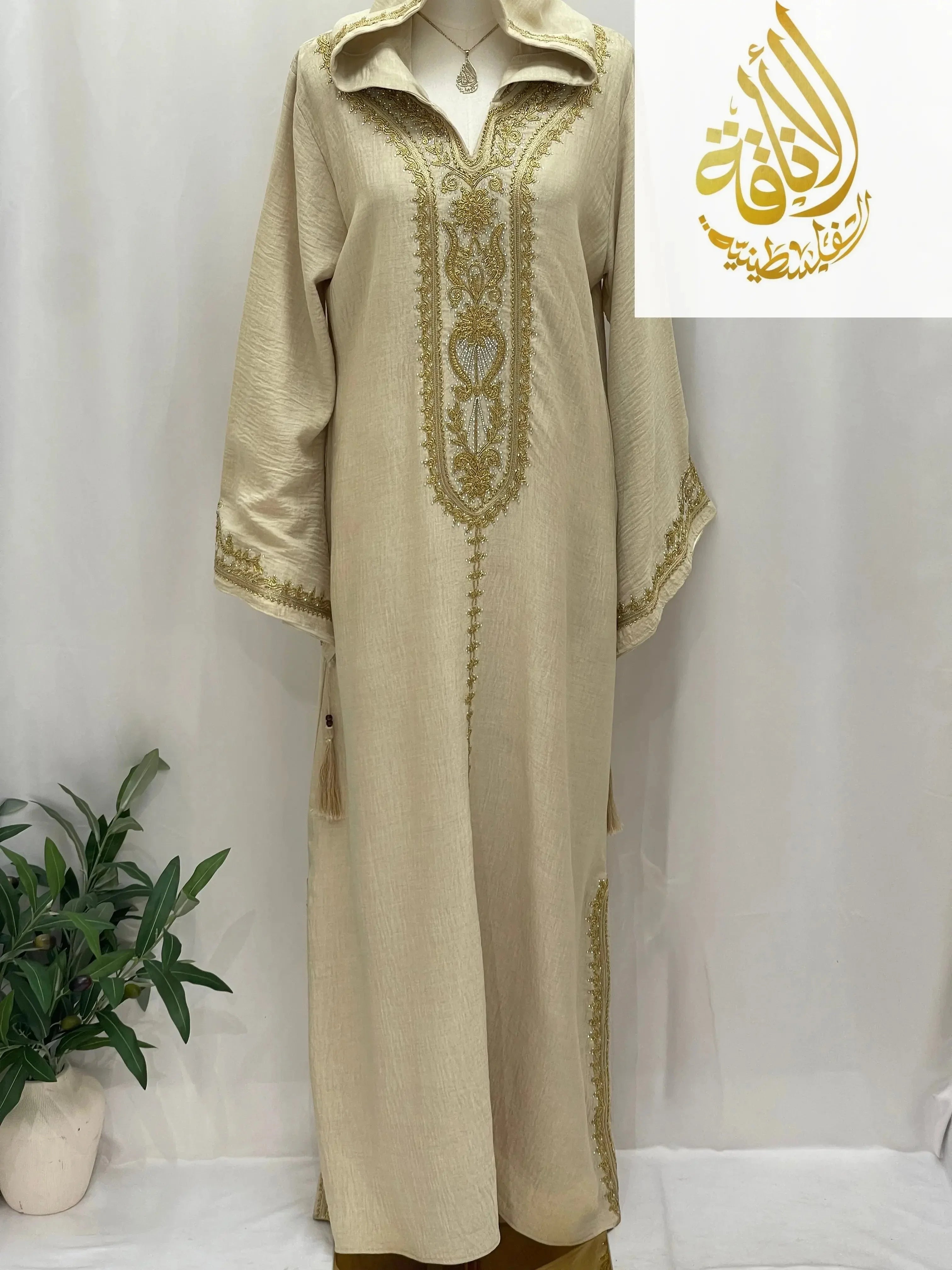 Palestinian Elegance Moroccan Embroidered Djellaba cream abaya with gold embroidery hood and tassels
