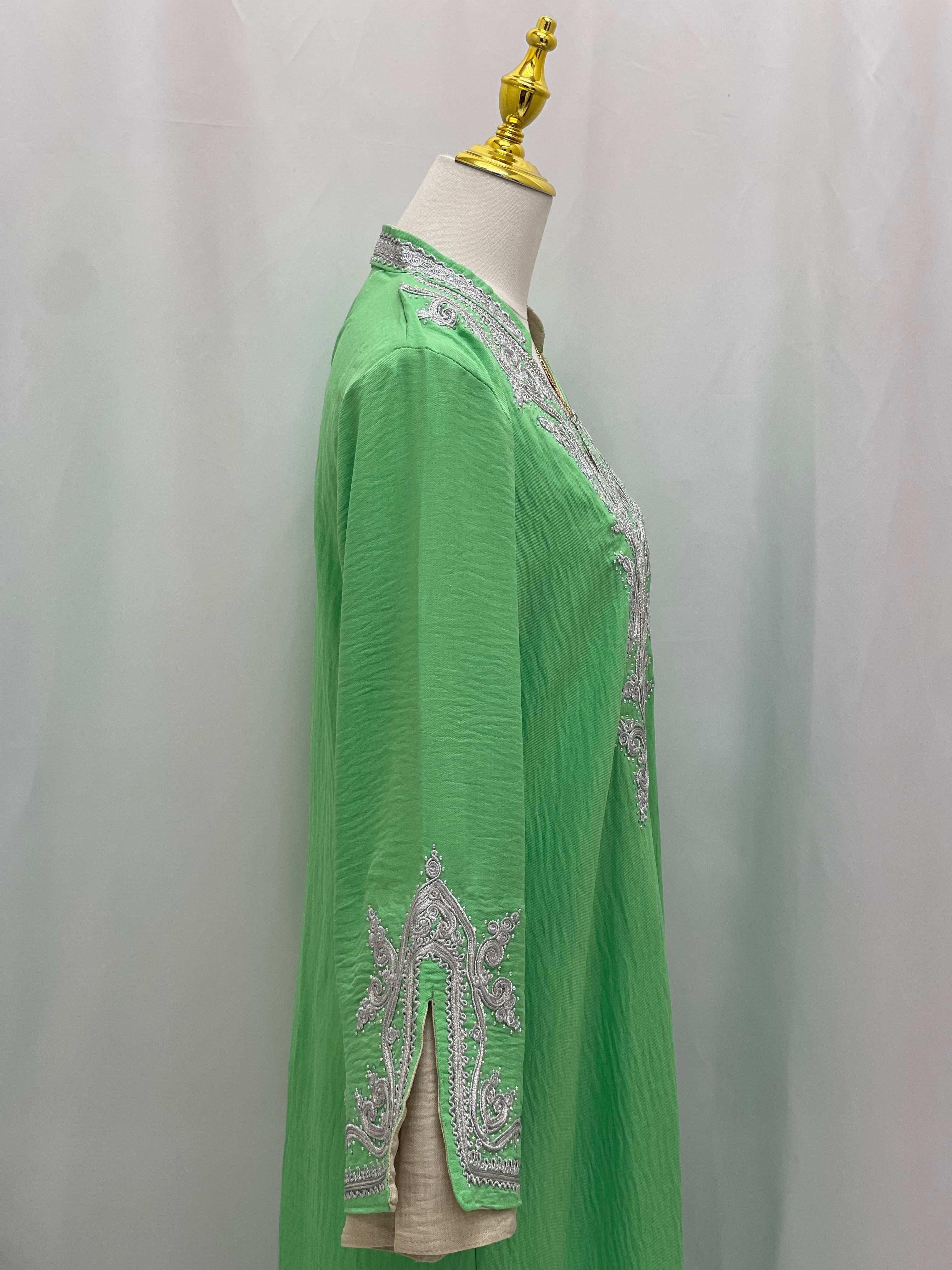Green Moroccan Rana Jalabia abaya with silver embroidery on sleeves and neckline by Palestinian Elegance
