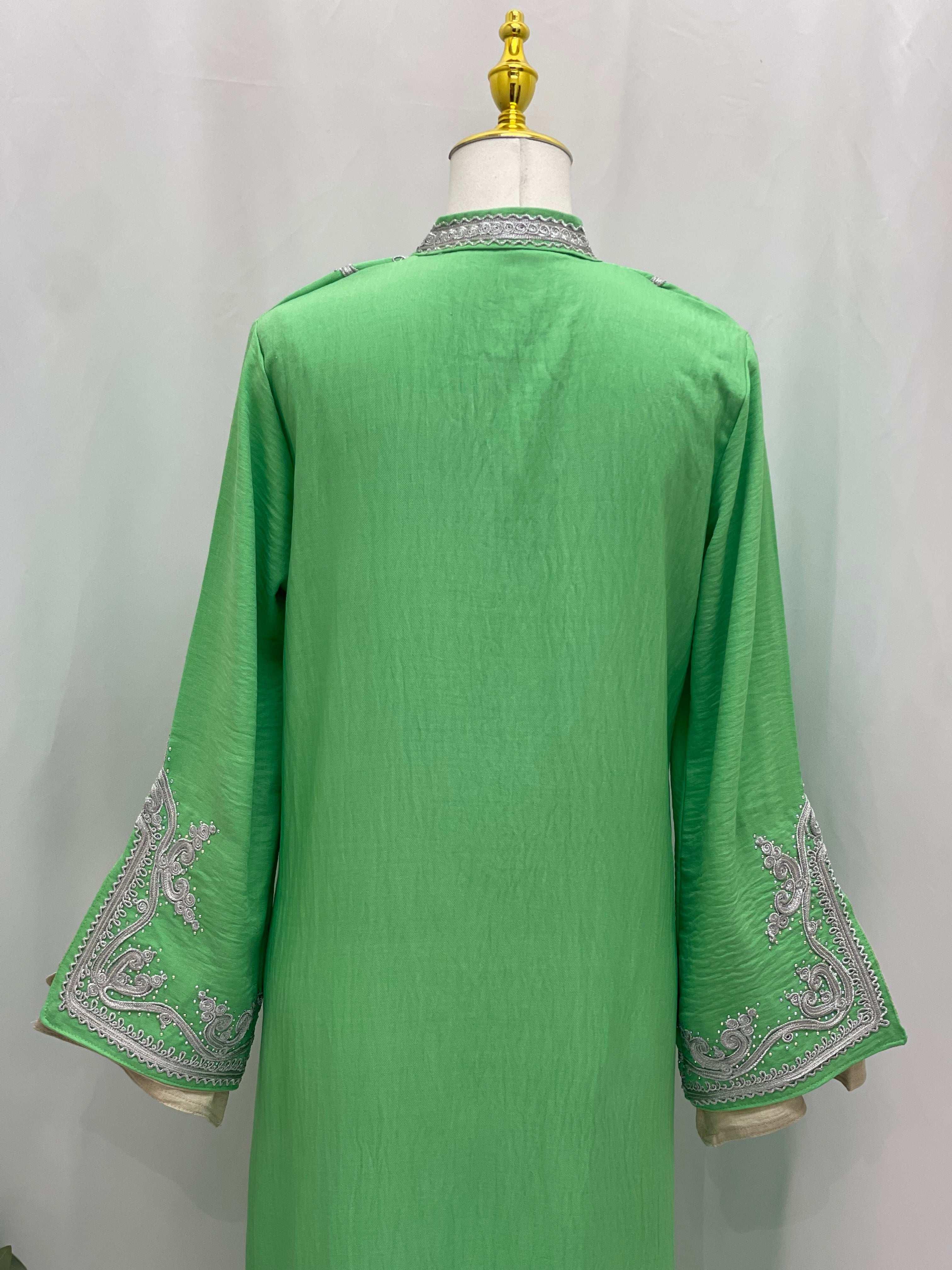 Back view of green Moroccan Rana Jalabia abaya with silver embroidery on sleeves by Palestinian Elegance