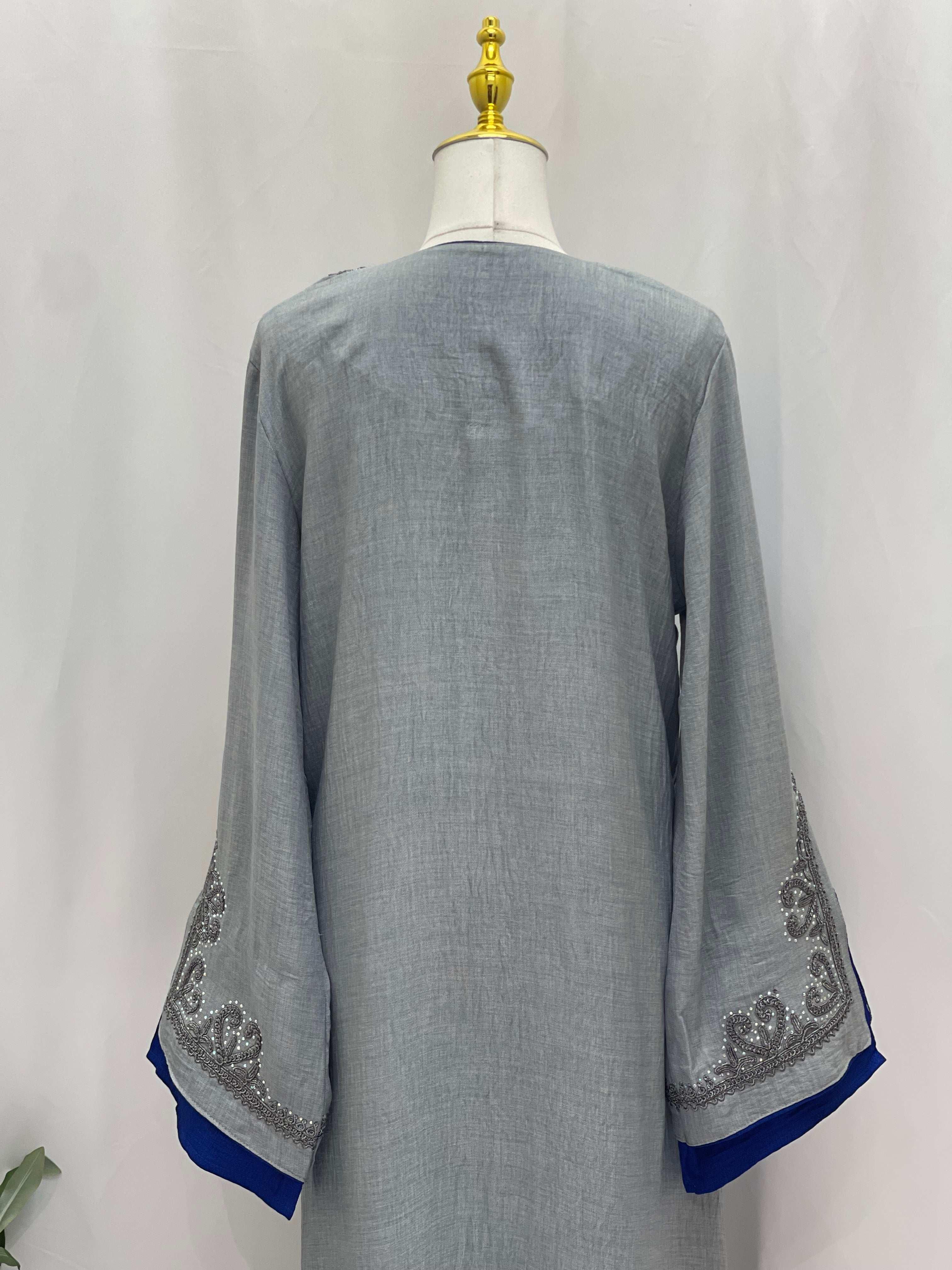 Back view of Palestinian Elegance Moroccan Rana Jalabia abaya in light gray with decorative sleeve details