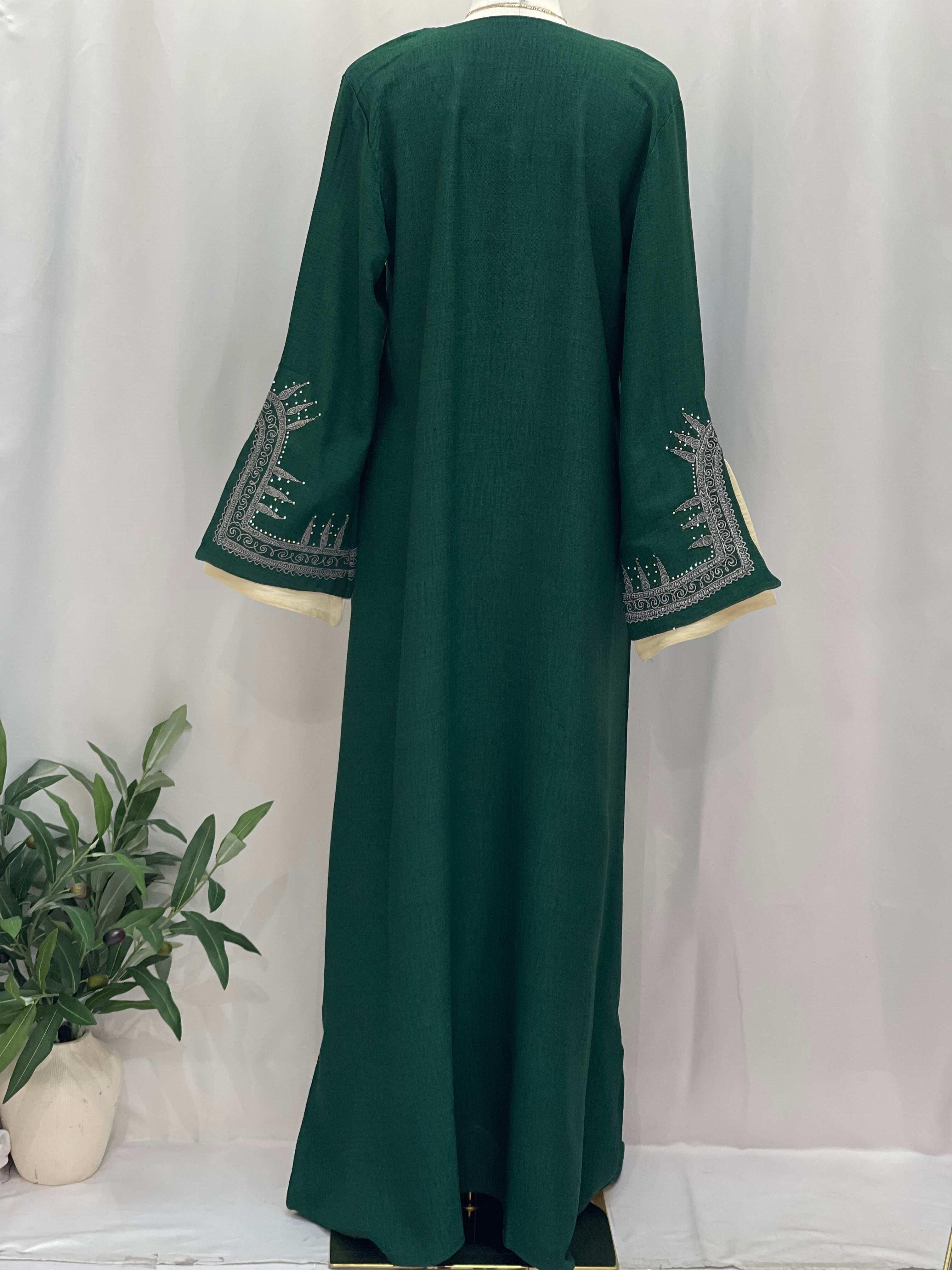 Palestinian Elegance Moroccan Salma Jalabia abaya in deep green with intricate silver sleeve embroidery