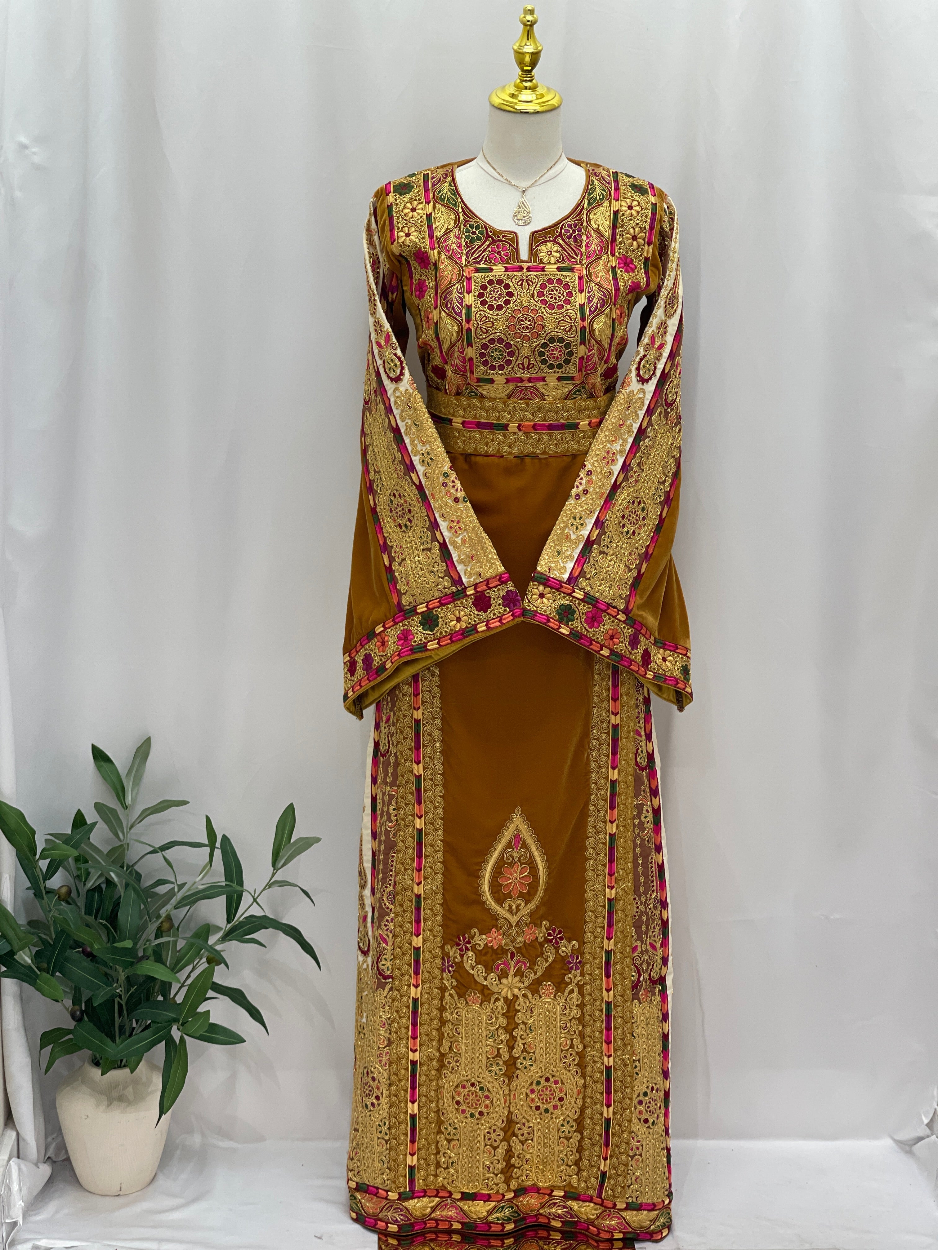 Traditional Malaka Embroidered Thoub by Palestinian Elegance in brown with intricate red and gold embroidery