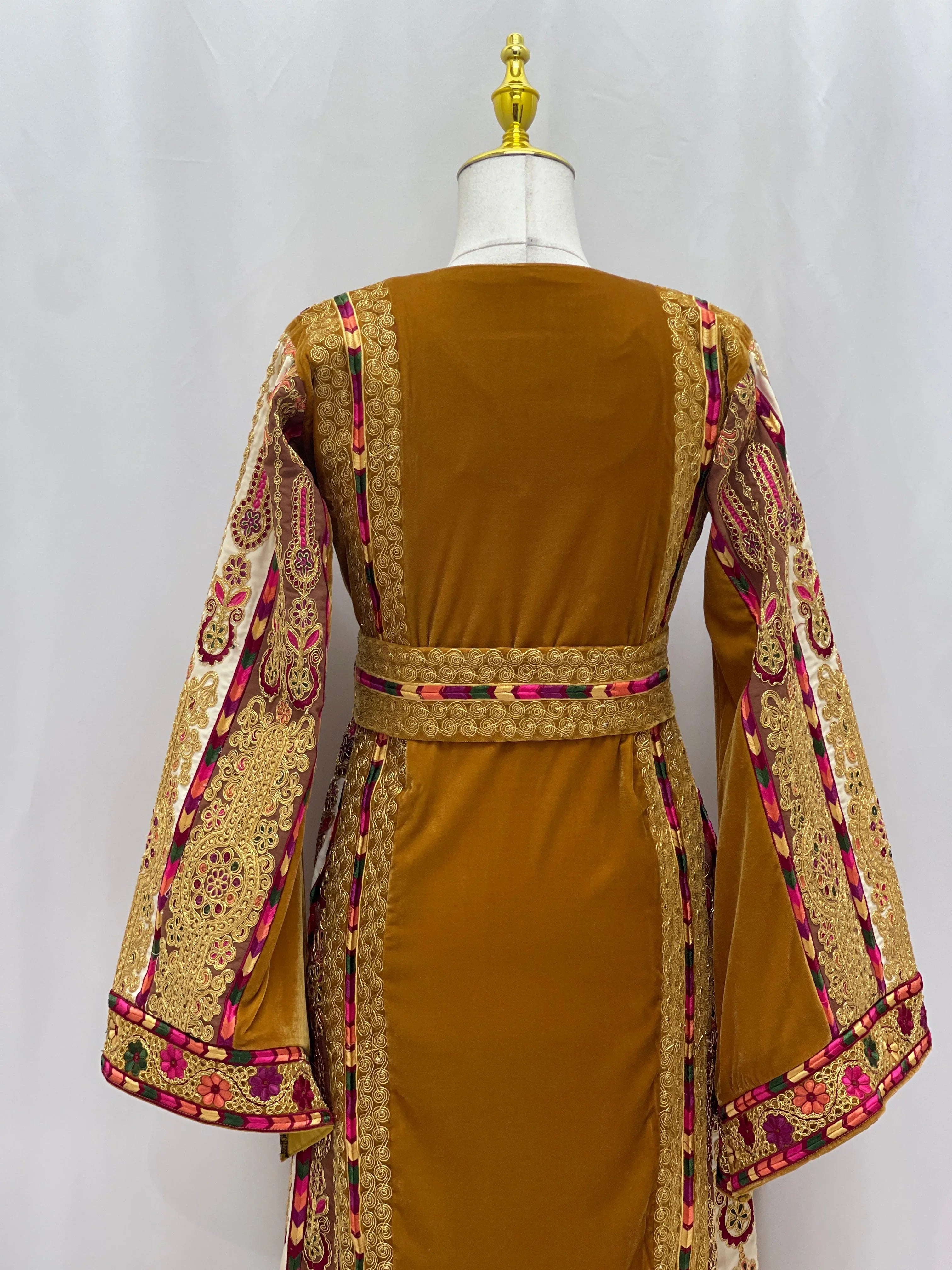 Traditional Malaka Embroidered Thoub by Palestinian Elegance featuring detailed gold and pink embroidery on sleeves and belt