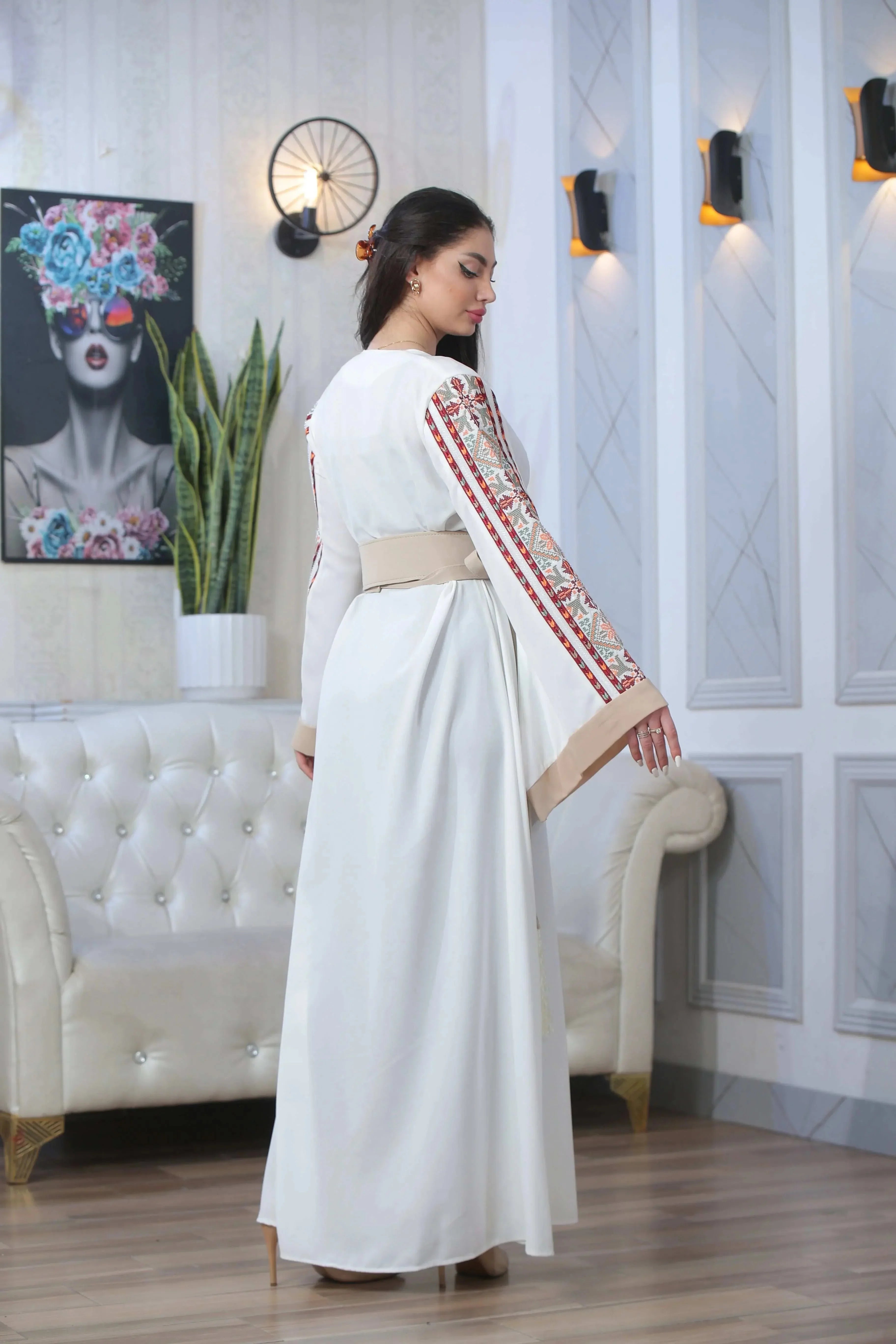 Palestinian Elegance Nadera Embroidered Thoub white with detailed red embroidery on sleeves and beige waist belt