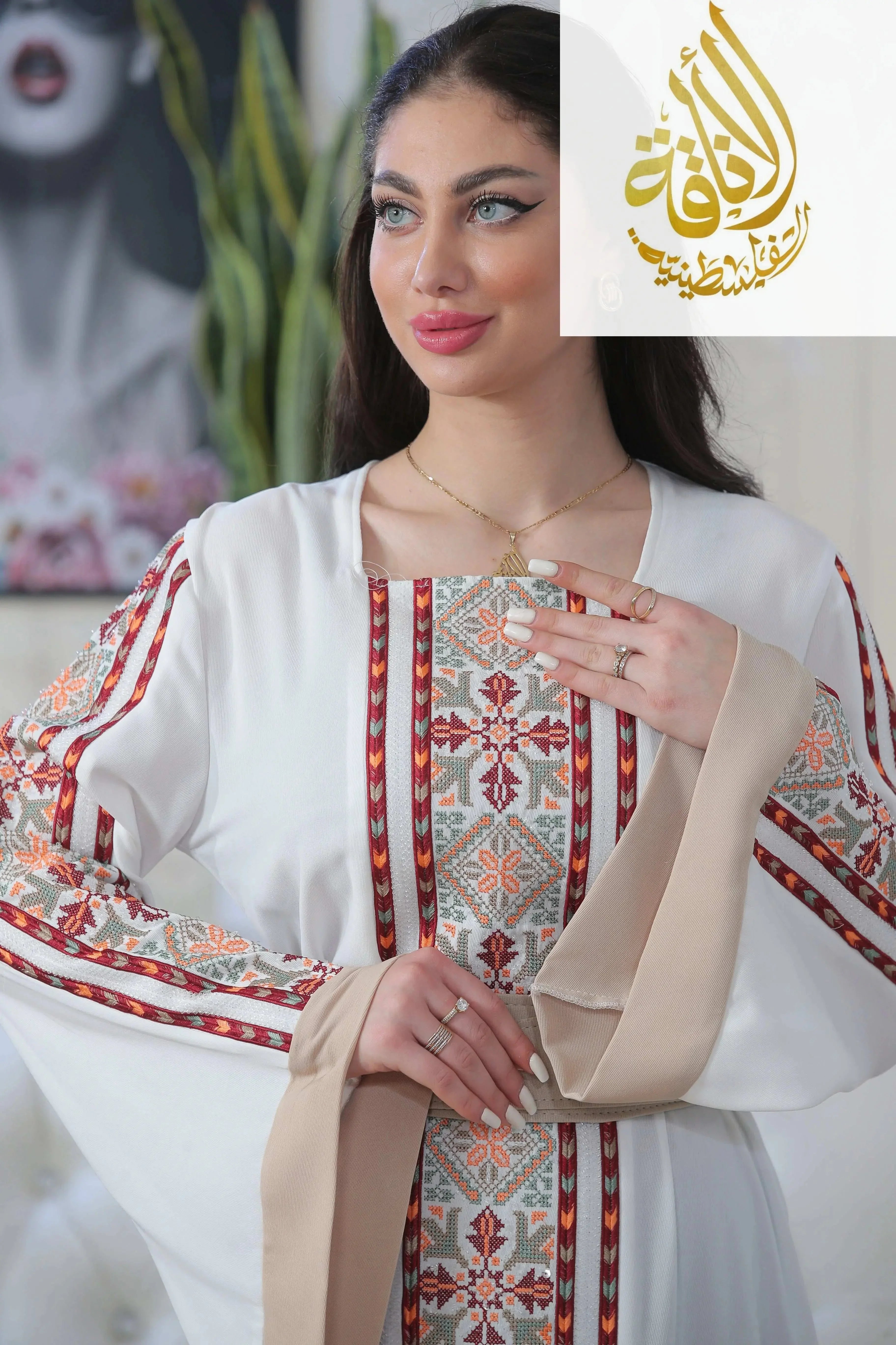 Palestinian Elegance Nadera Embroidered Thoub featuring intricate traditional embroidery on white fabric