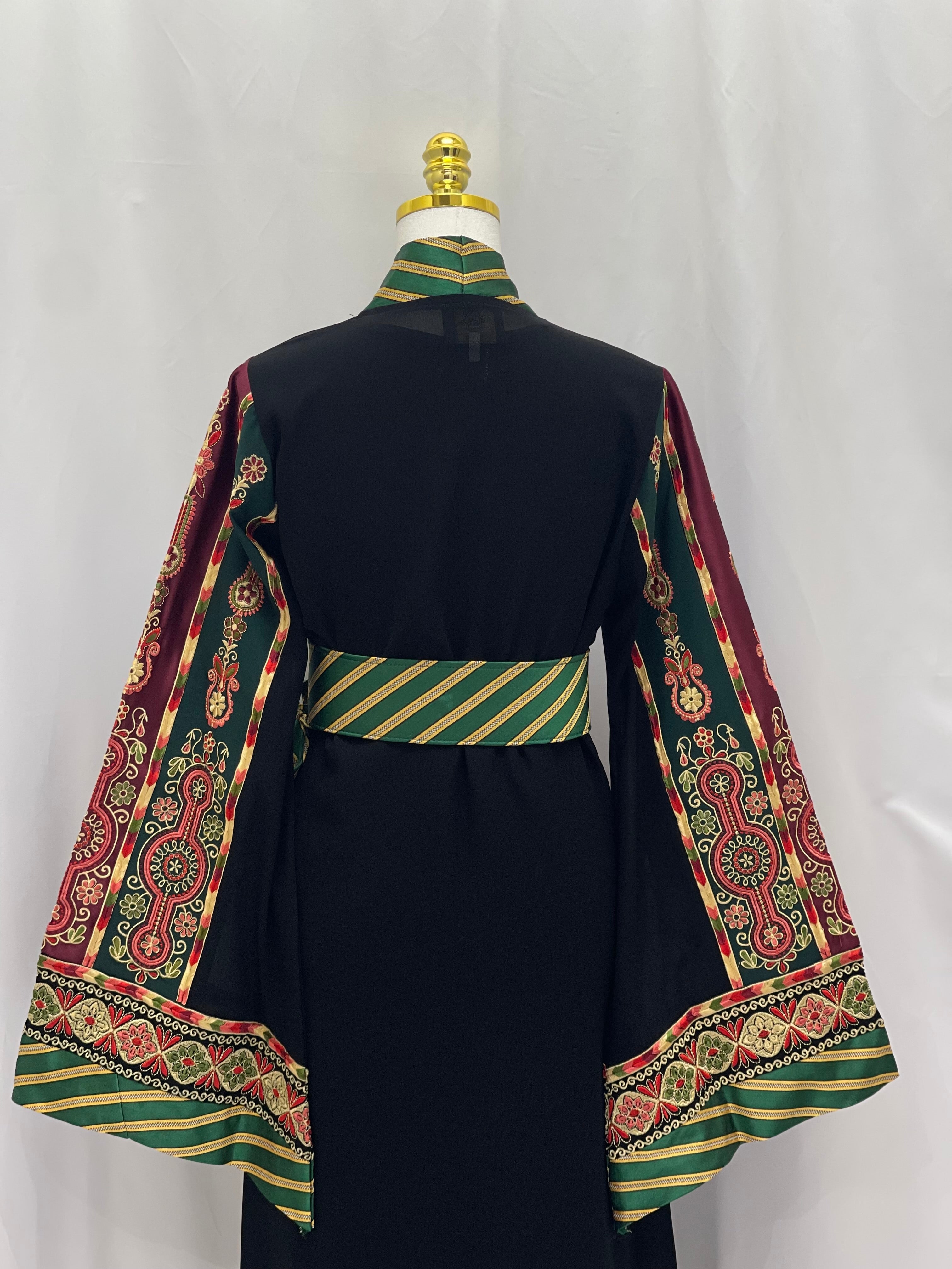 Back view of Narmeen embroidered Kashmir open abaya with intricate red and green embroidered sleeves and striped green belt