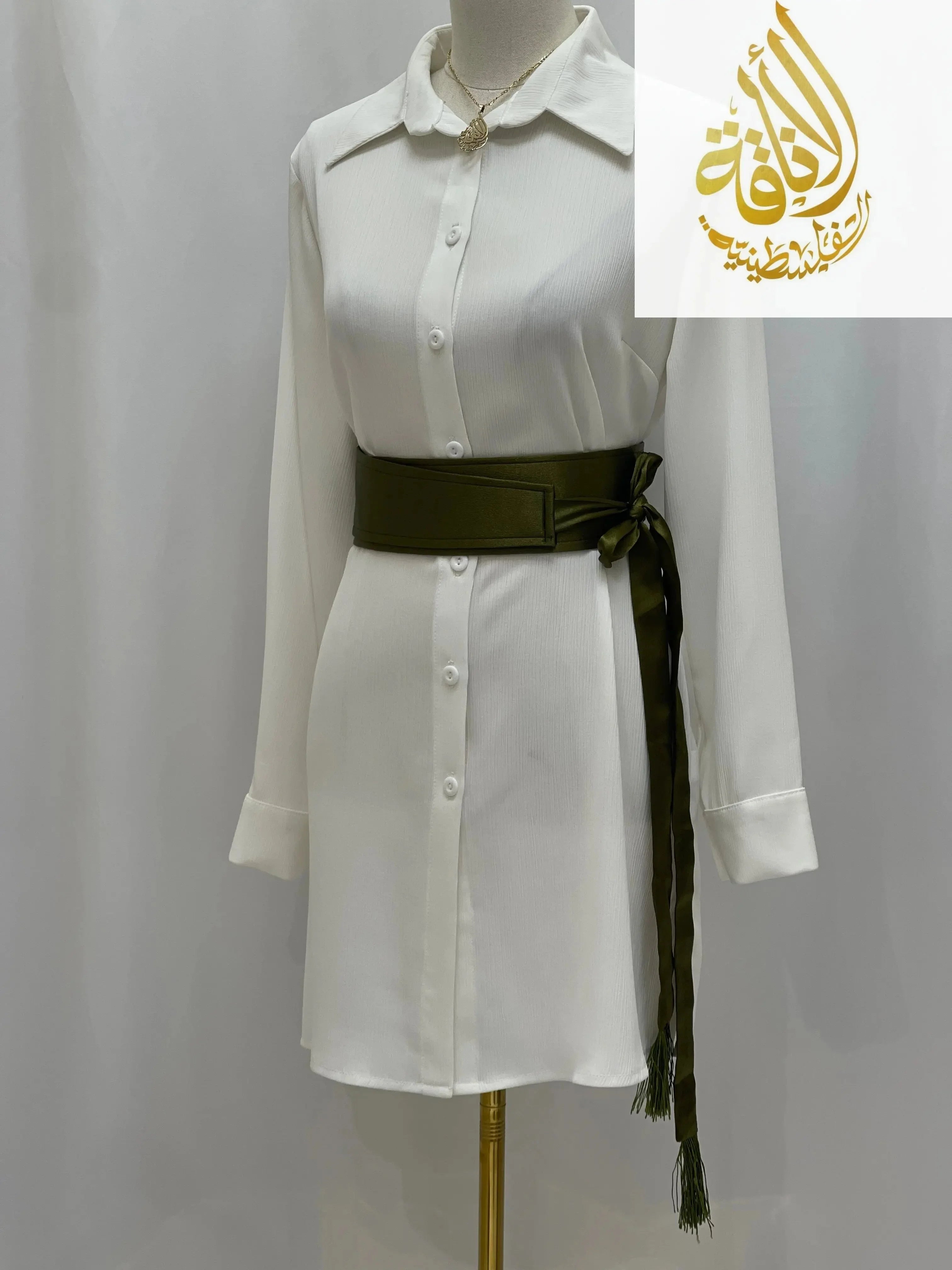 Olive green satin belt for dresses styled on white button-down shirt dress with long sleeves