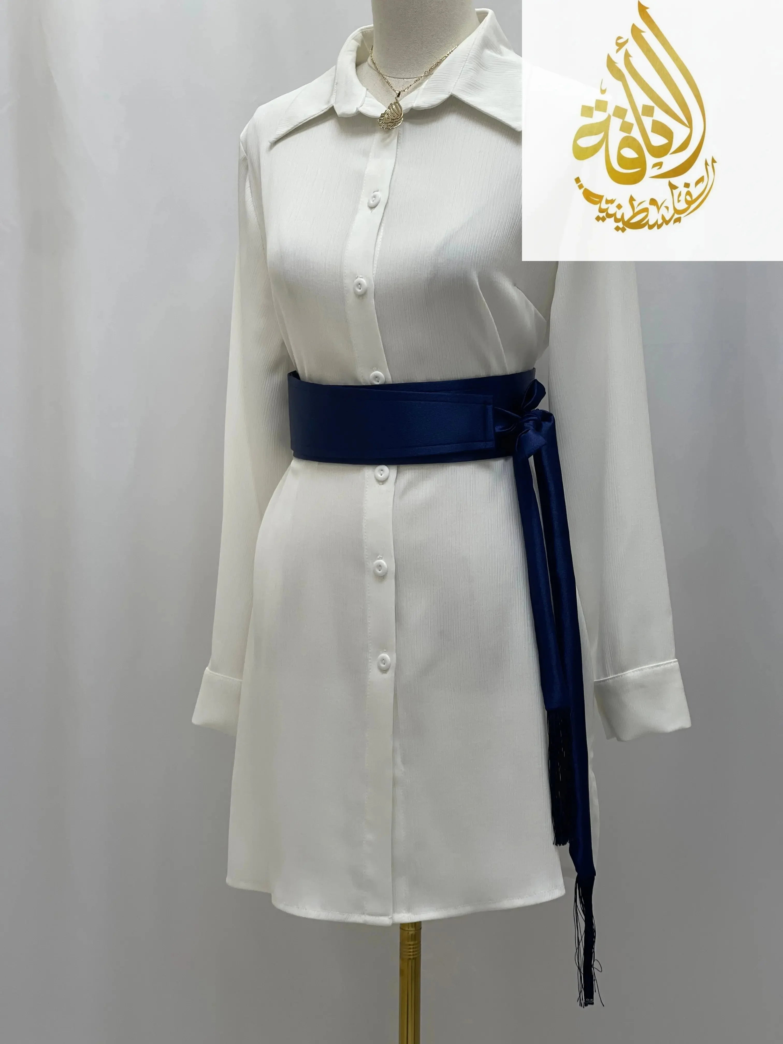 Palestinian Elegance navy satin belt for dresses tied around white button-down shirt dress