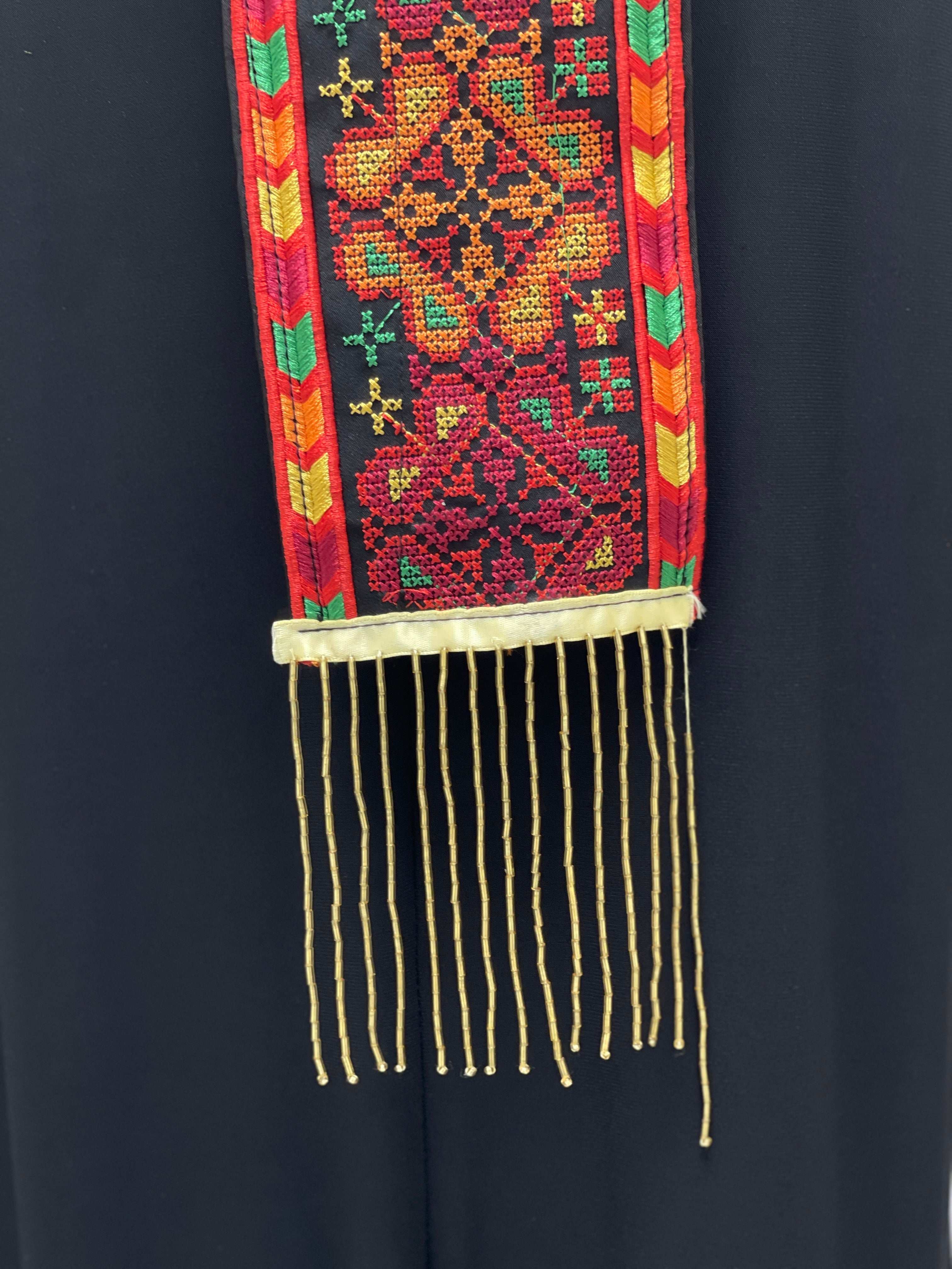 Palestinian Elegance Lerat featuring vibrant traditional stitching and fringes with Embroidered Lairs Awka design