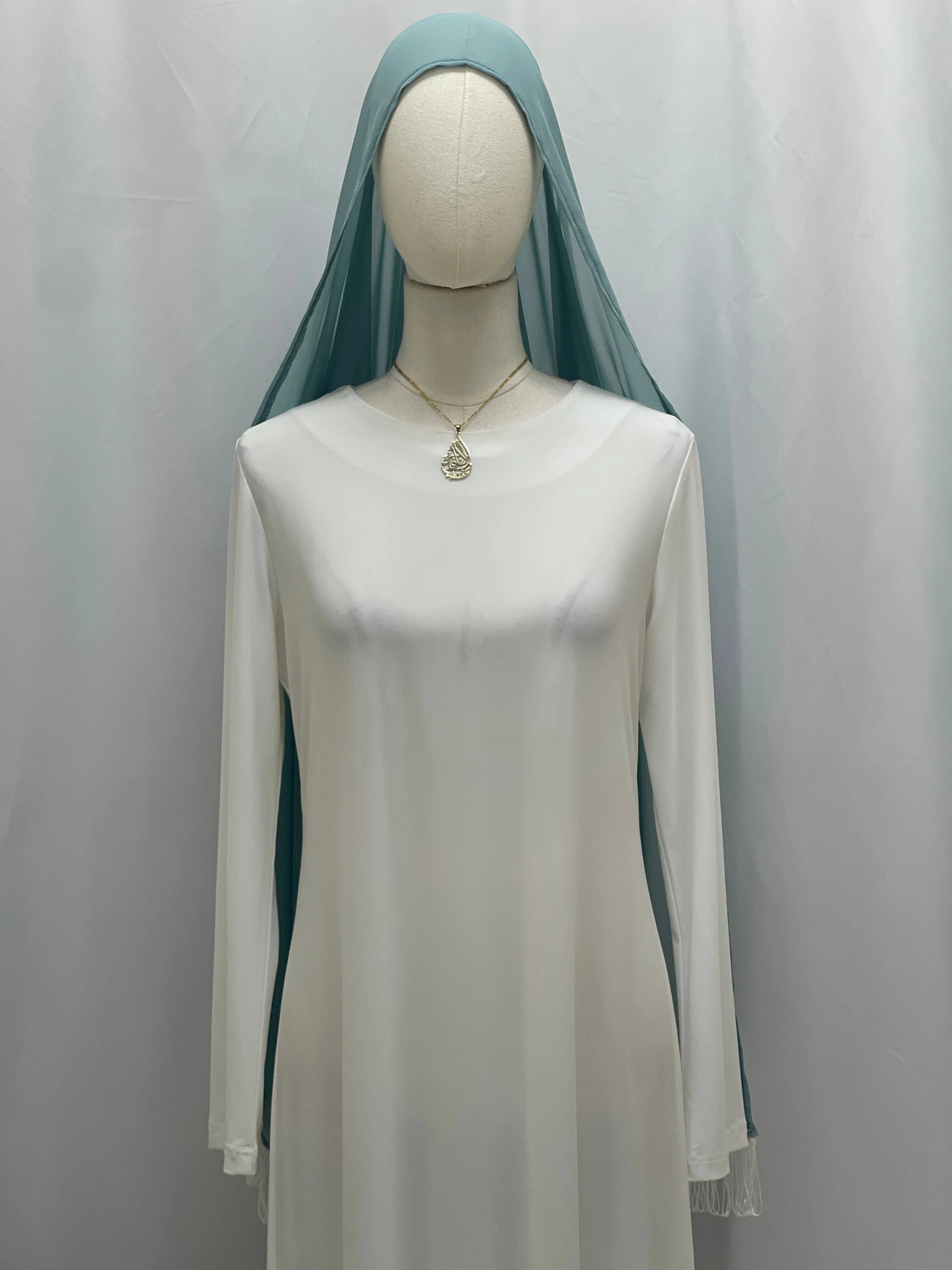 New Khirka With White tassel Palestinian Elegance white flowy khirka dress with teal head veil on mannequin
