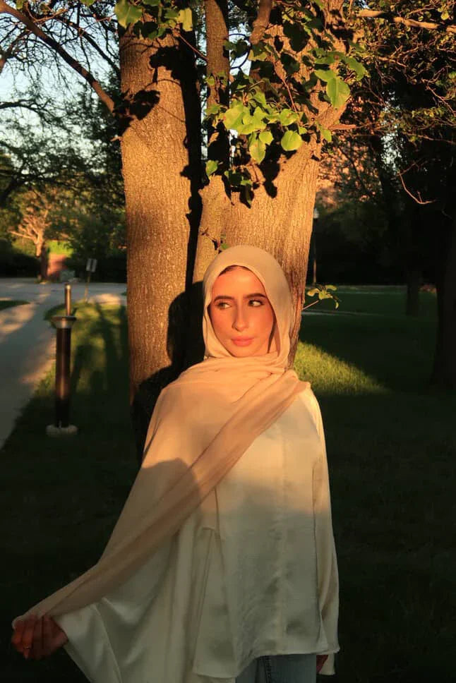 Palestinian Elegance New Modal Hijab beige scarf worn by woman outdoors at sunset draped over shoulders