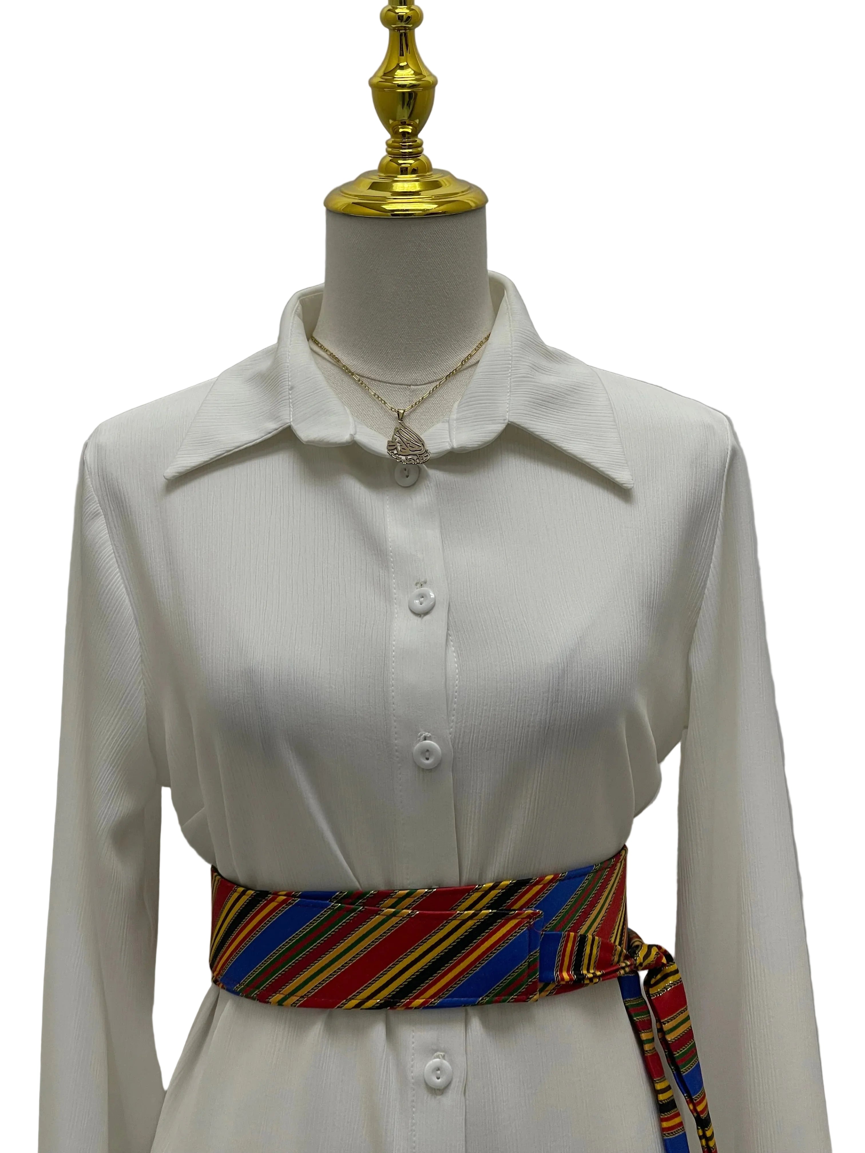 Saya Belt colorful striped waist sash by Palestinian Elegance on white button up dress on mannequin