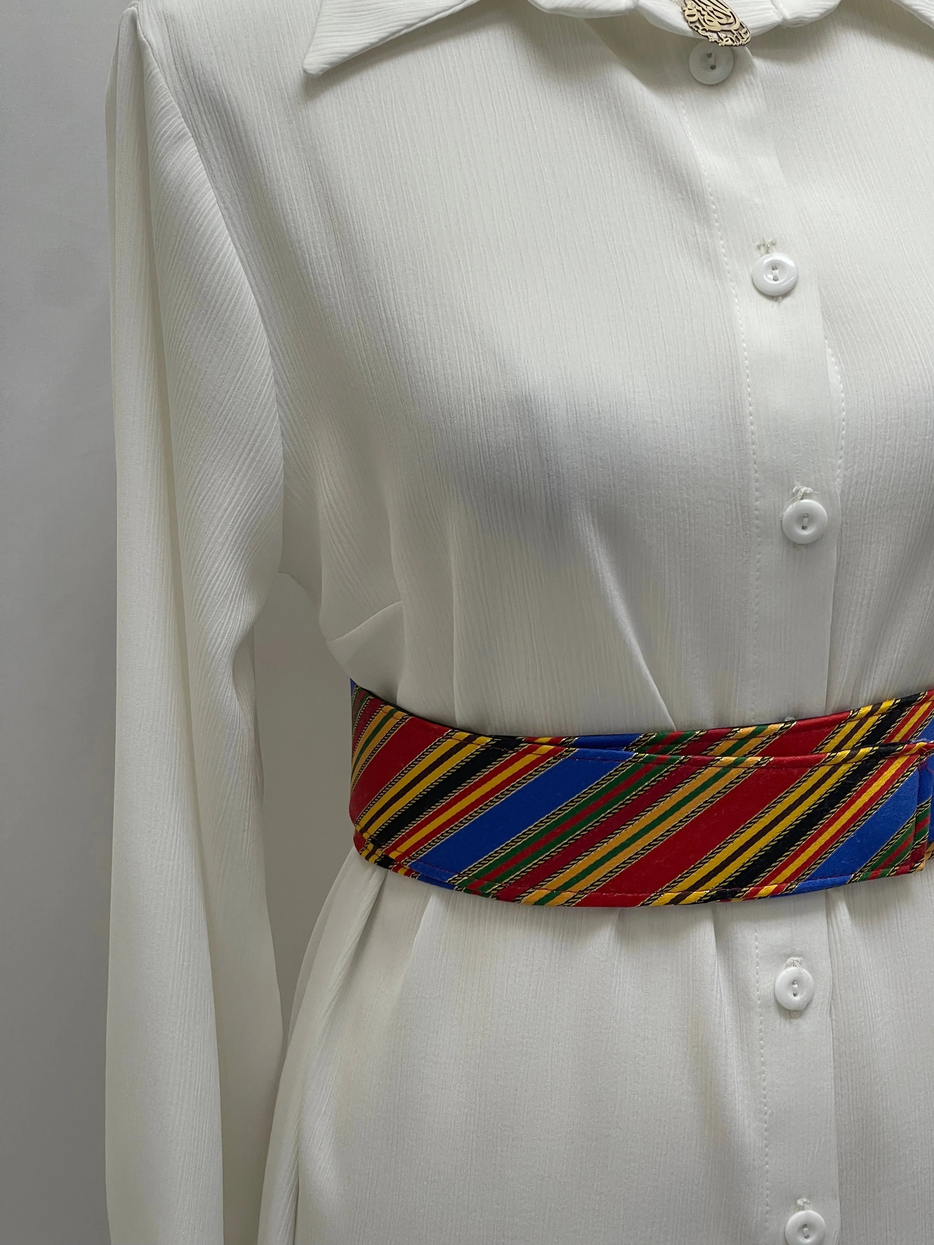 Saya Belt colorful striped woven waist belt by Palestinian Elegance styled over white button shirt