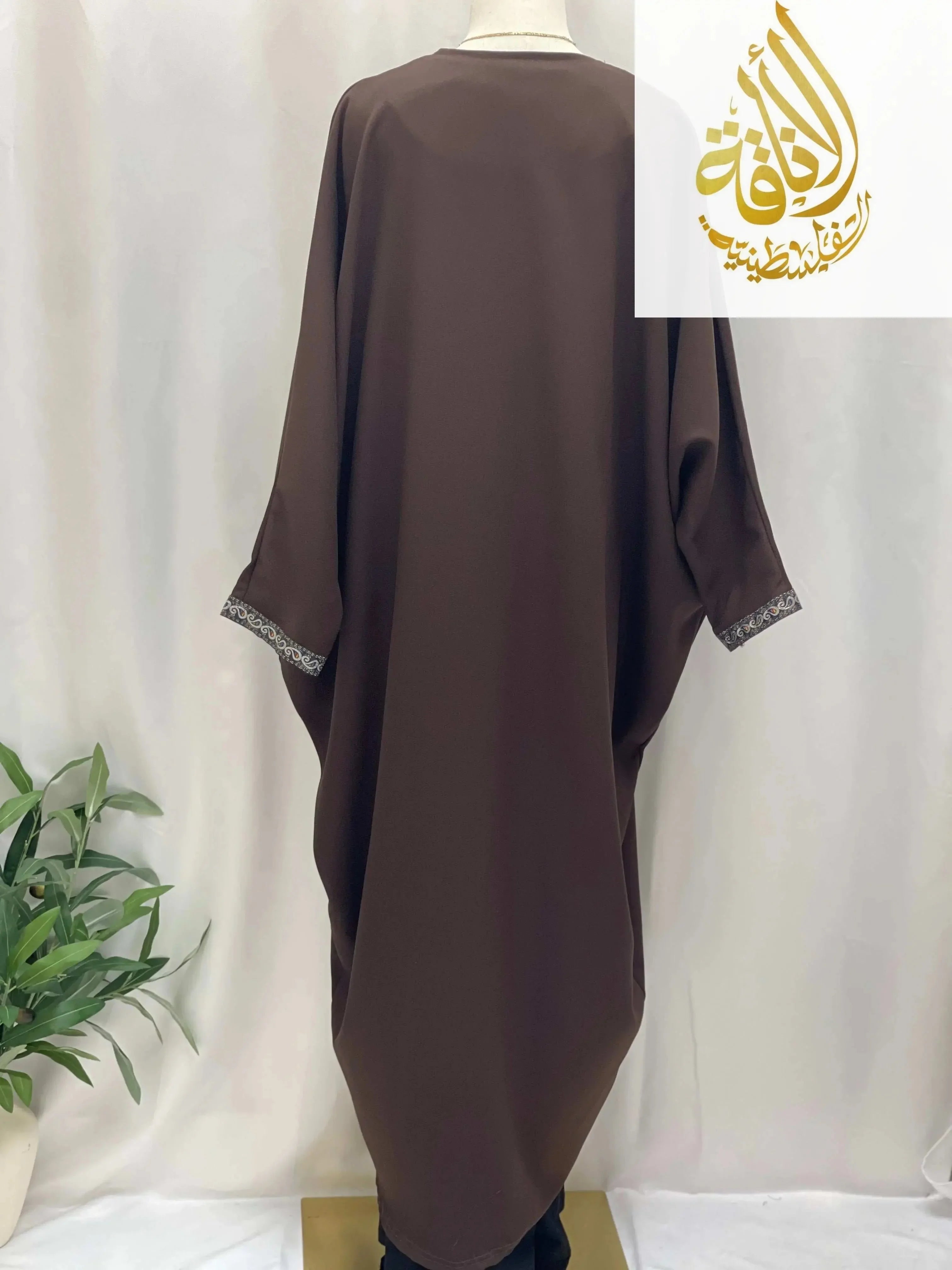 Back view of Palestinian Elegance Nijma Free Size kimono cardigan in brown with subtle embroidery on cuffs