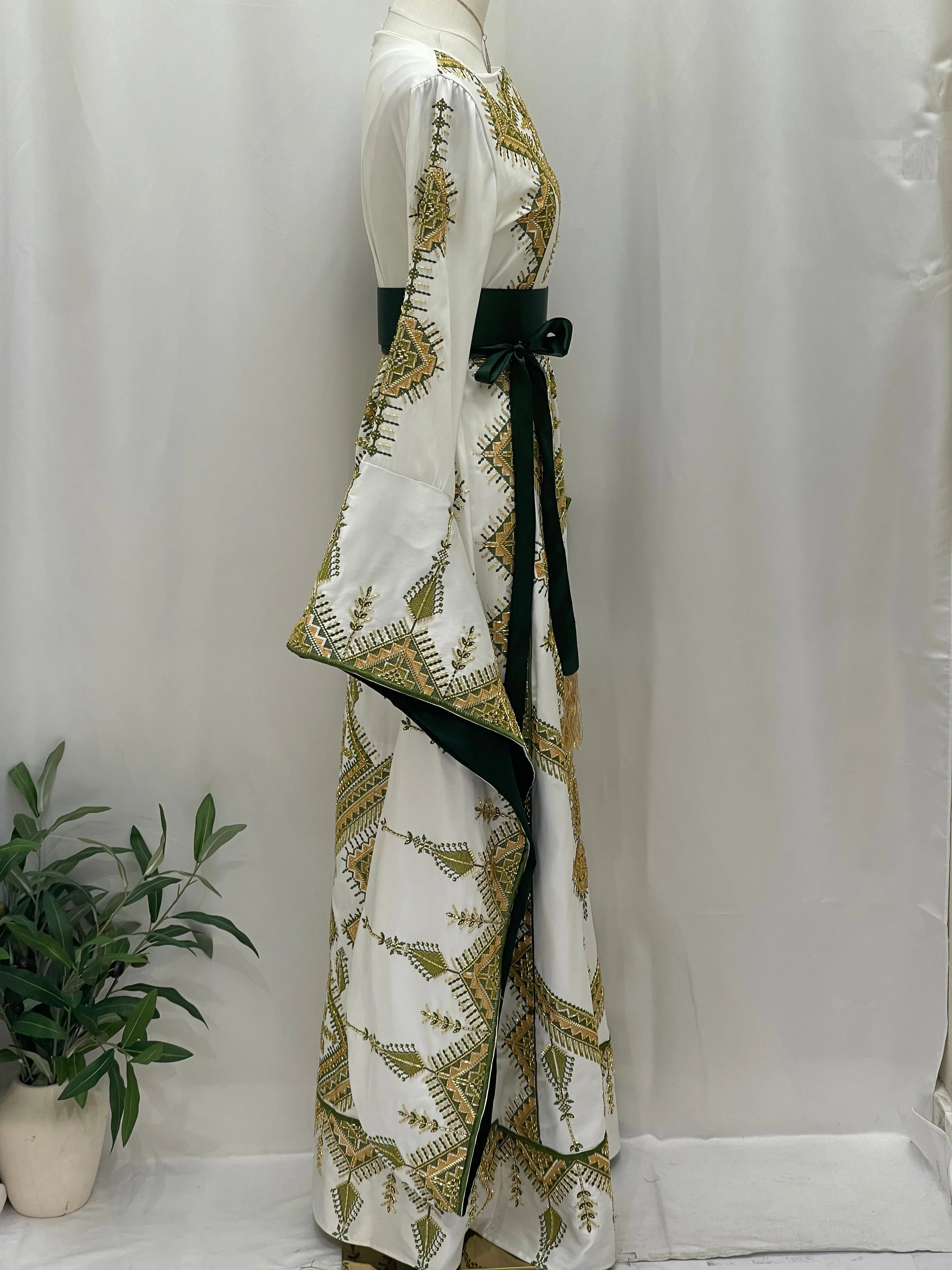 Olive Bloom Bridal Embroidered Dress by Palestinian Elegance white gown with gold olive embroidery and velvet waist sash