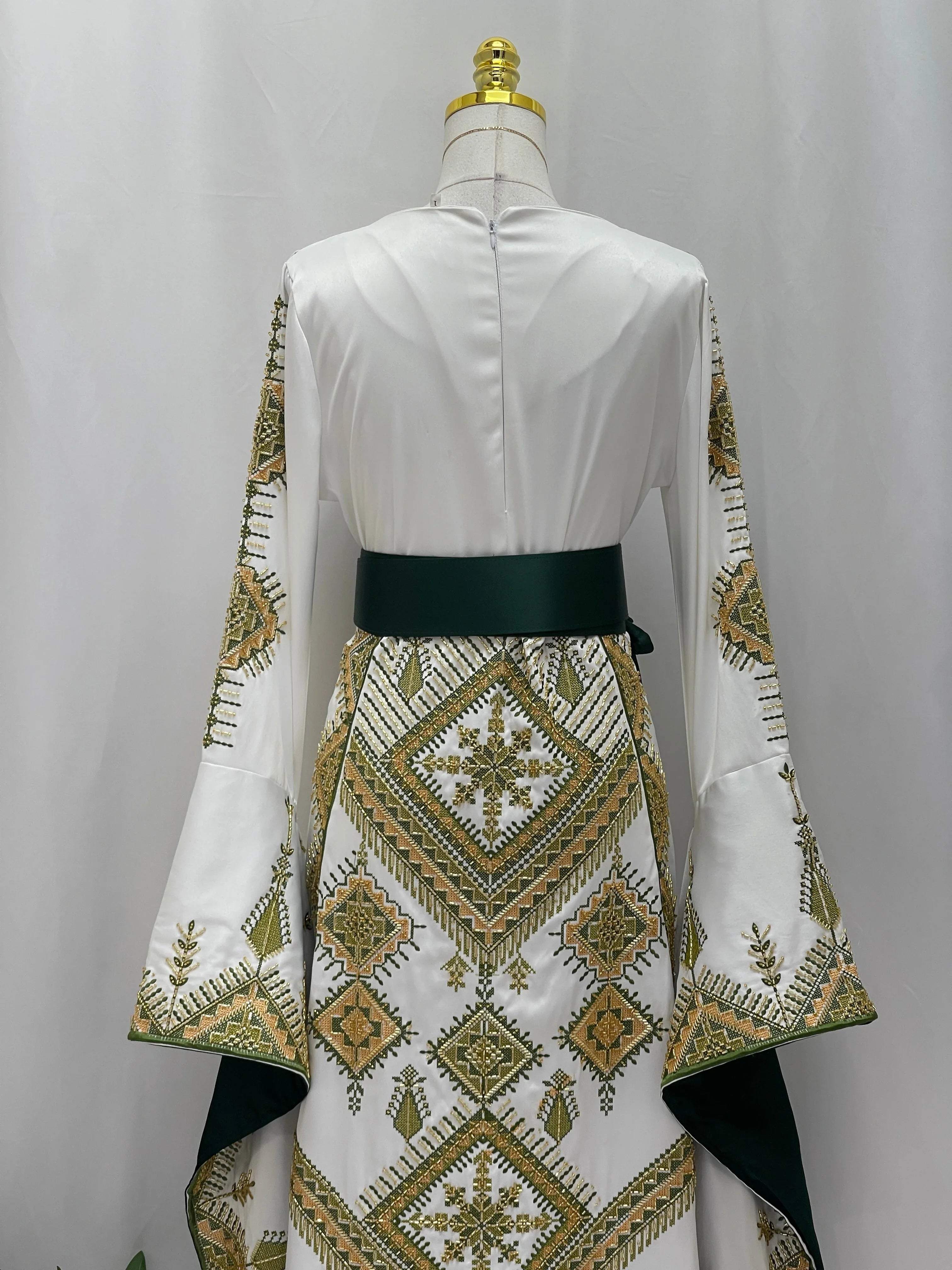 Olive Bloom Bridal Embroidered Dress back view white gown with green and gold Palestinian embroidery and dark green sash