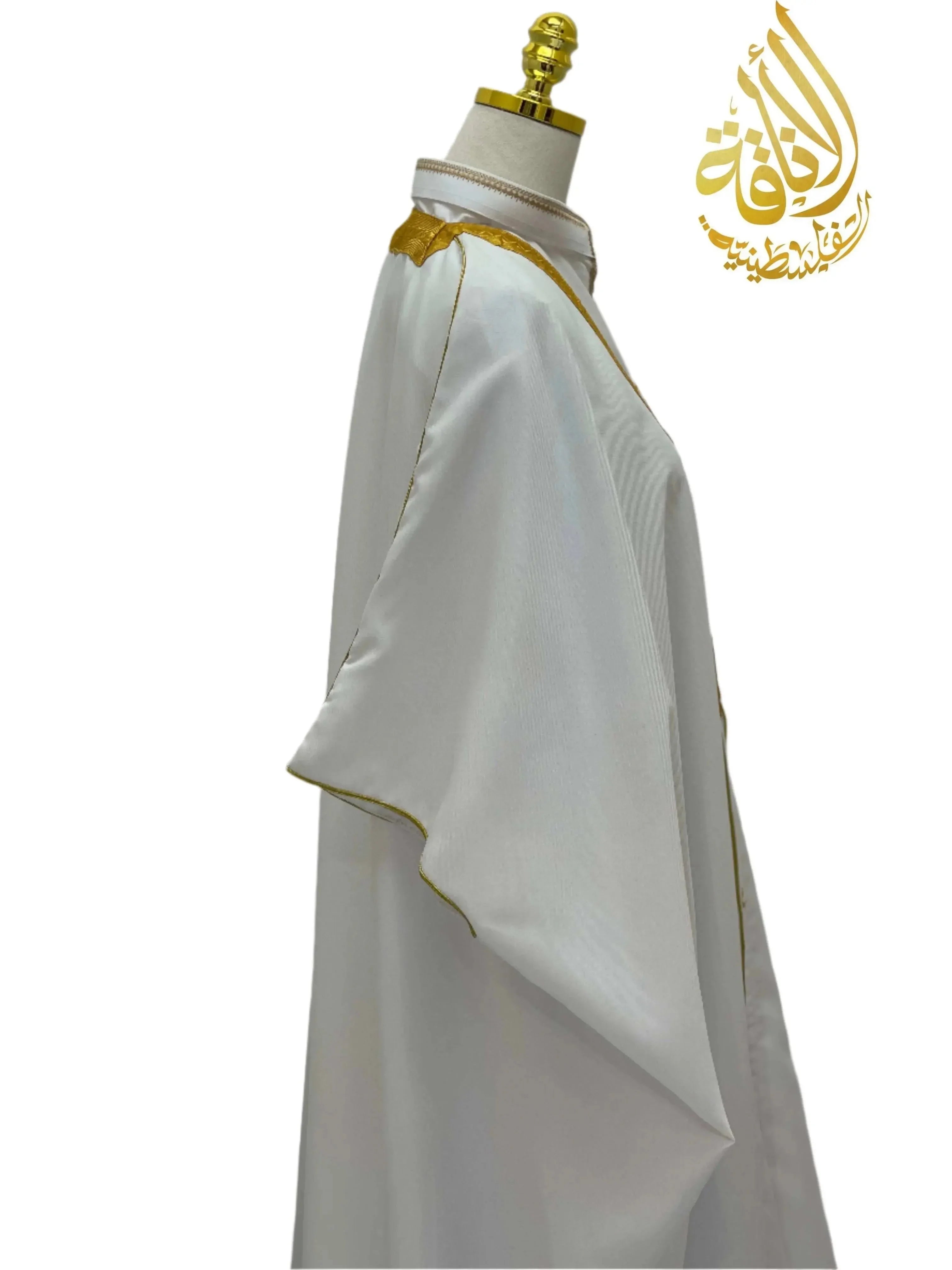 Omar Mens White Bisht Thobe Robe with gold trim displayed on a mannequin by Palestinian Elegance