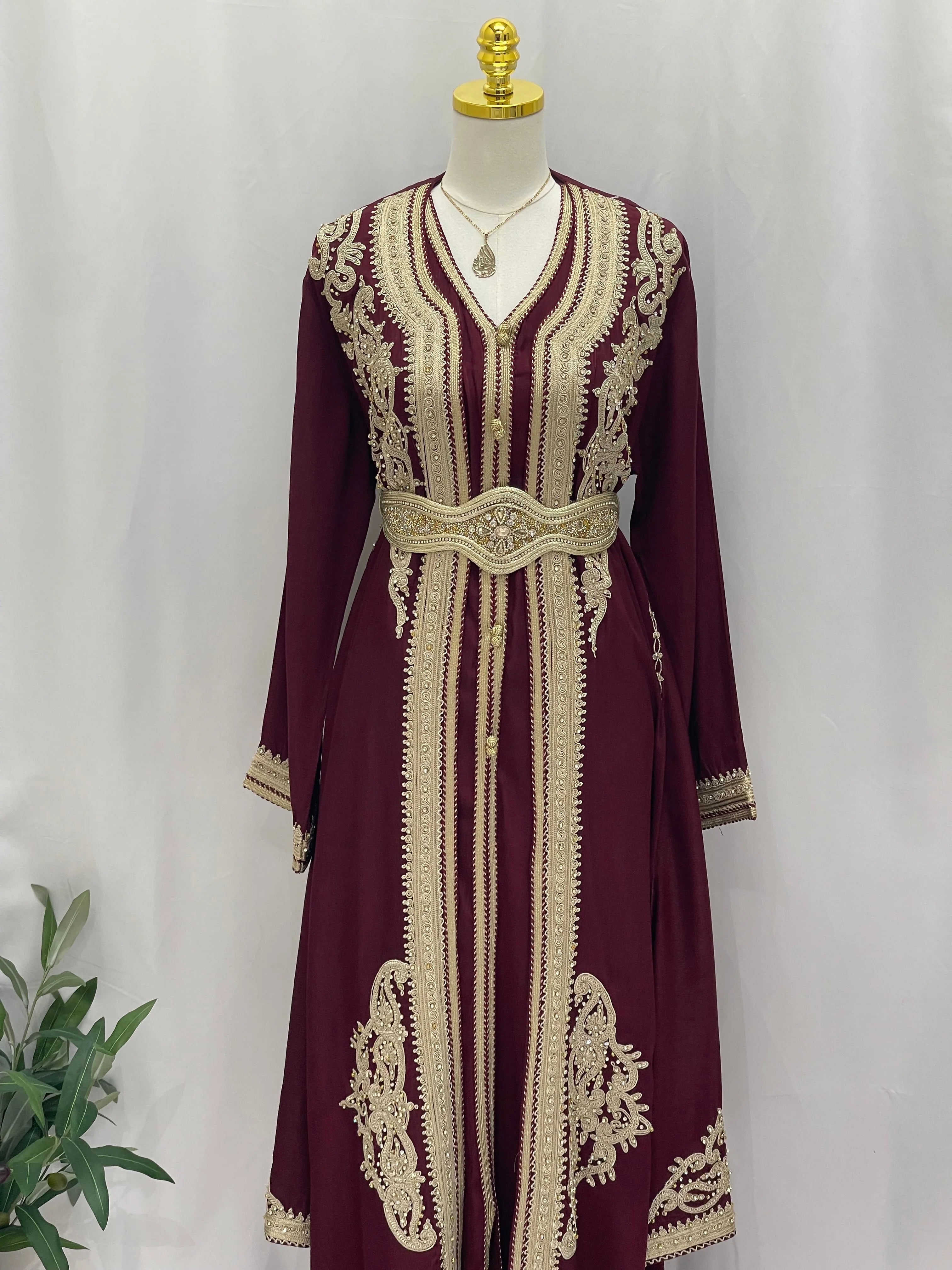 Omima Morocco Style Kaftan by Palestinian Elegance in maroon with intricate gold and matching belt