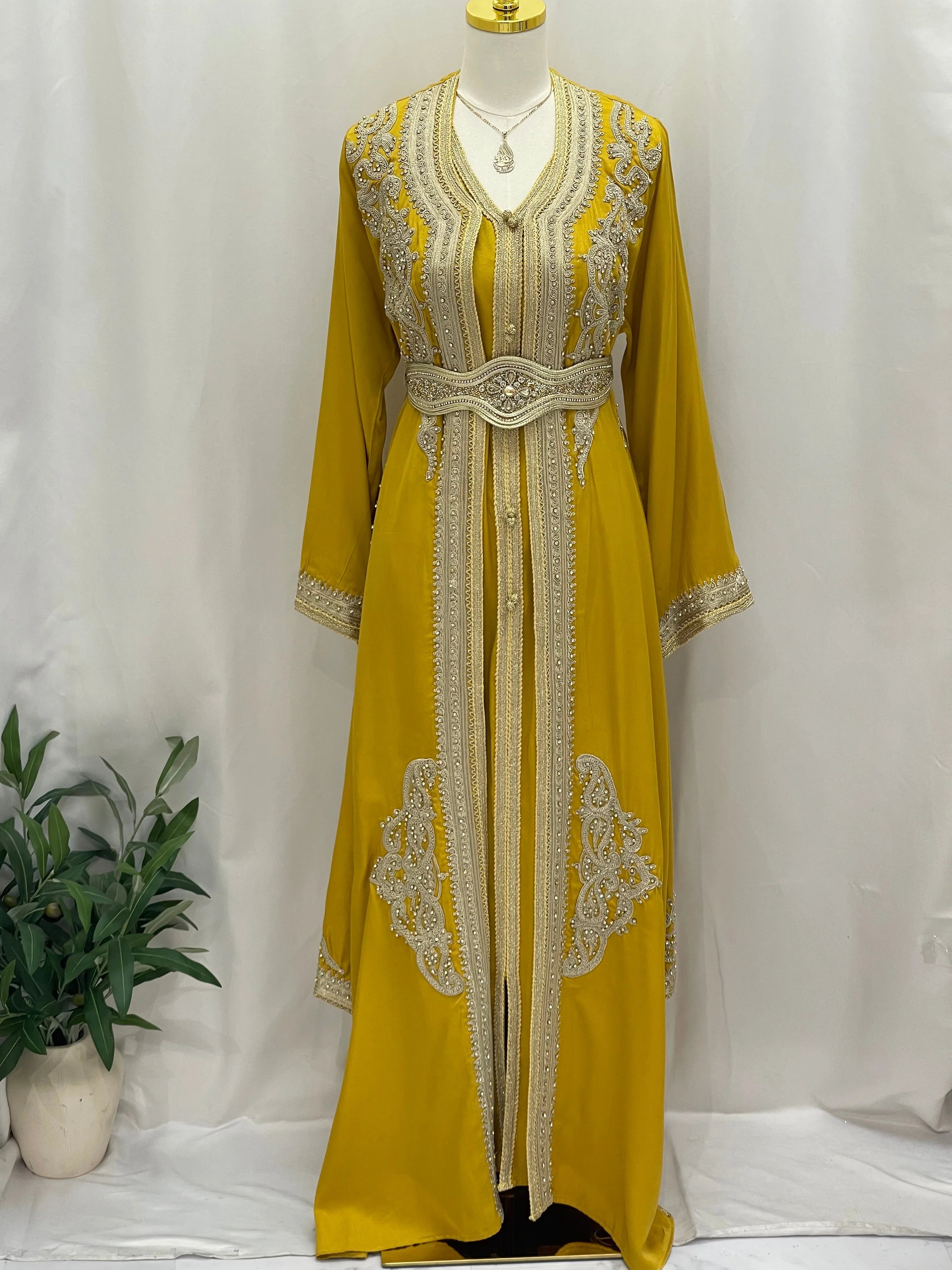 Omima Morocco Style Kaftan in mustard yellow with intricate silver embroidery and matching belt by Palestinian Elegance