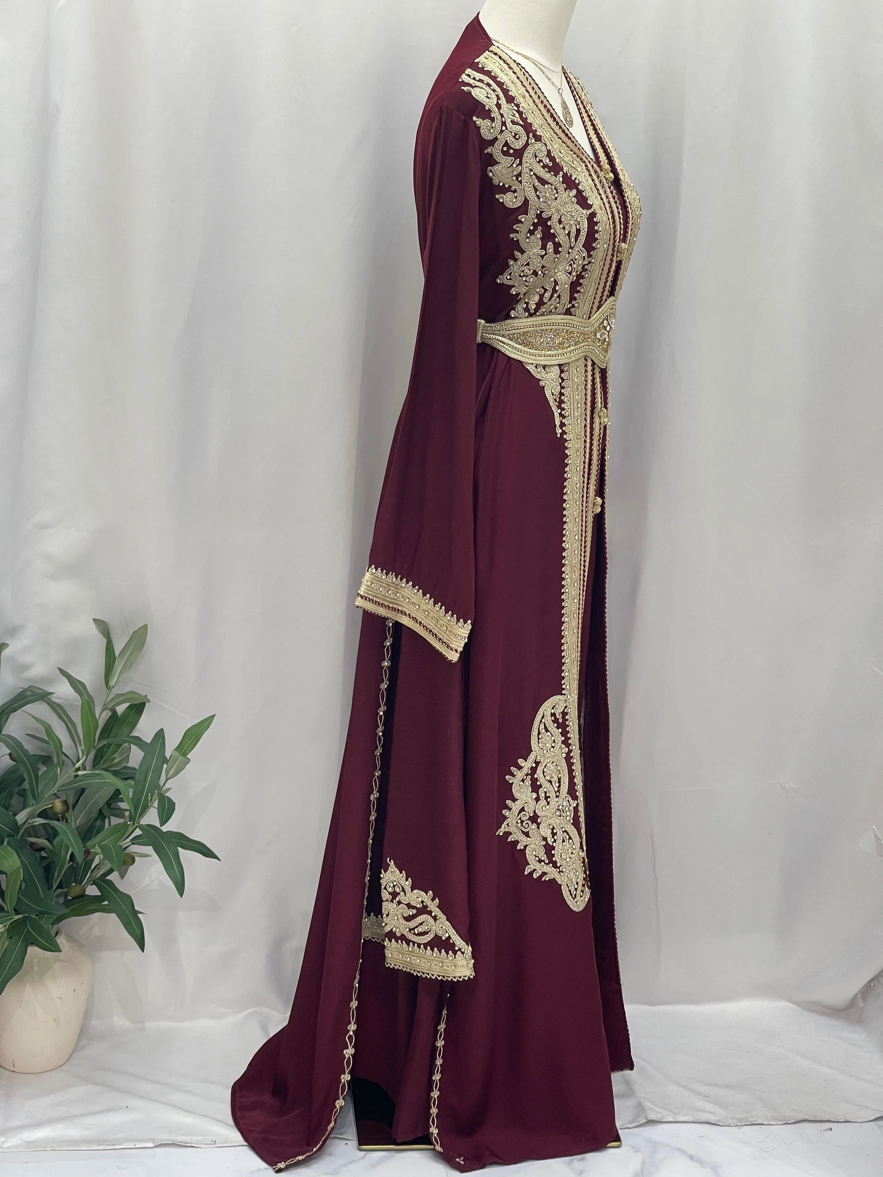 Elegant maroon Omima Morocco Style Kaftan with intricate gold embroidery and a matching belt by Palestinian Elegance