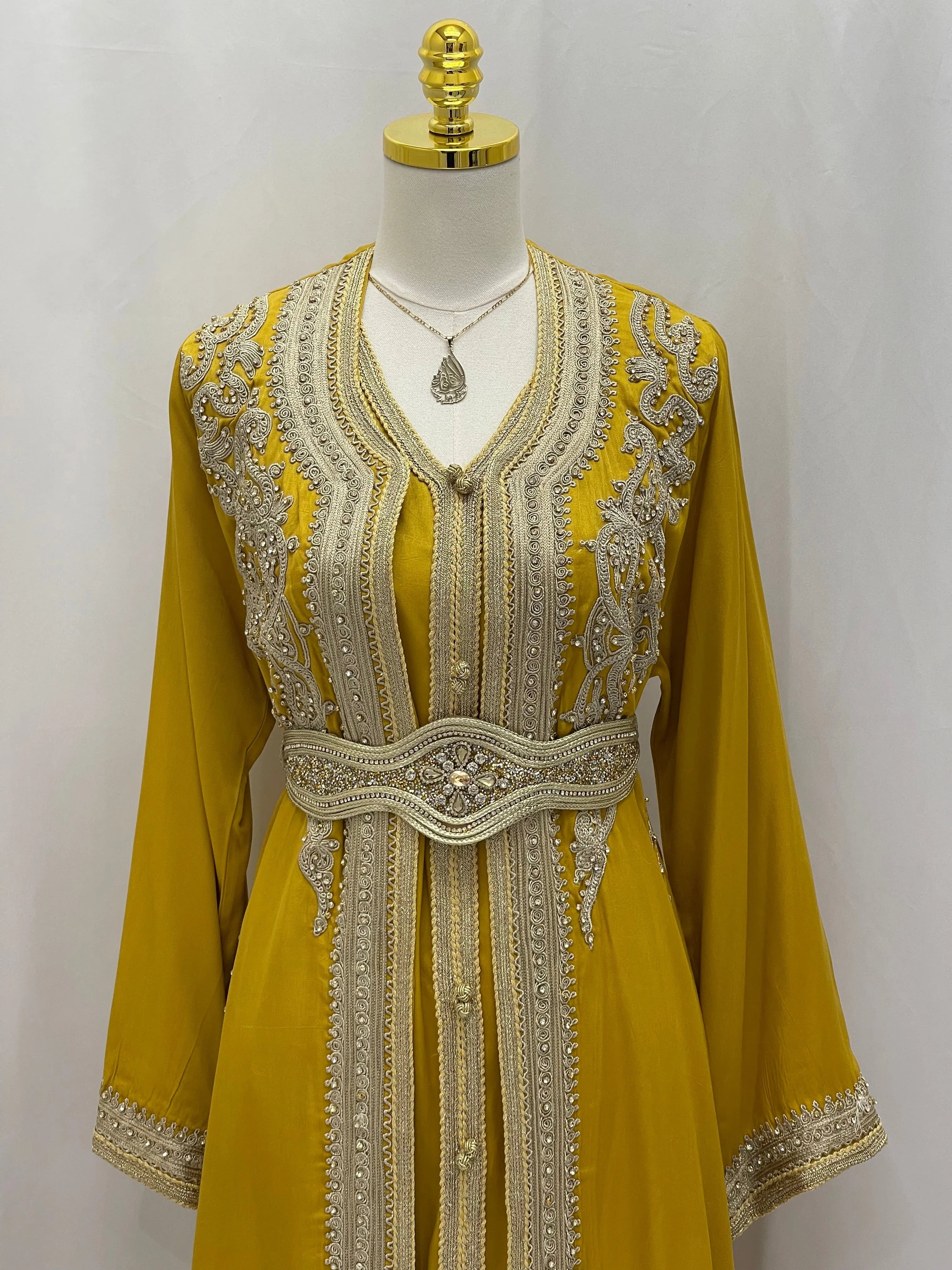 Omima Morocco Style Kaftan by Palestinian Elegance in yellow with intricate silver embroidery and matching belt