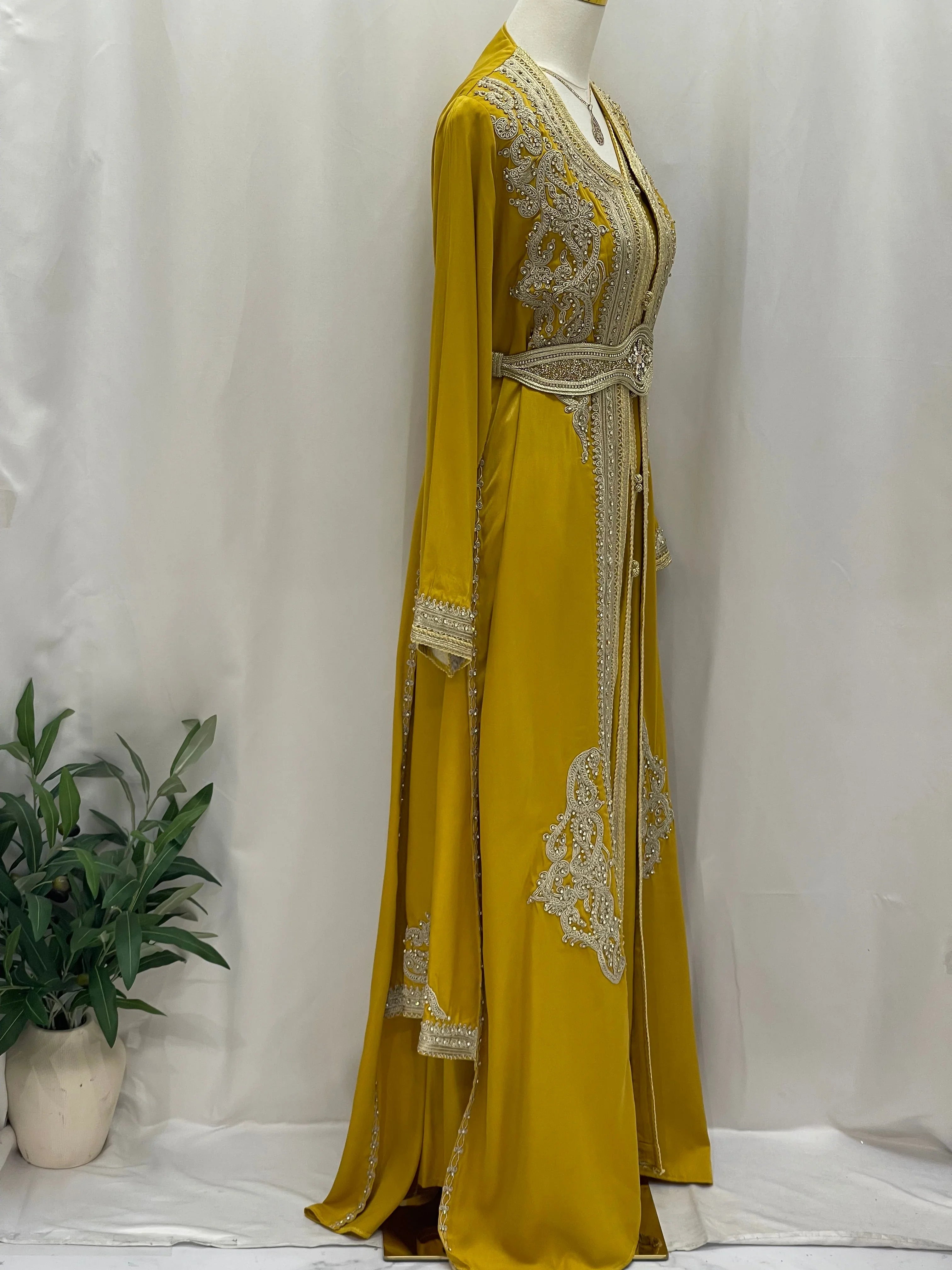 Omima Morocco Style Kaftan by Palestinian Elegance in mustard yellow with intricate silver embroidery and belt