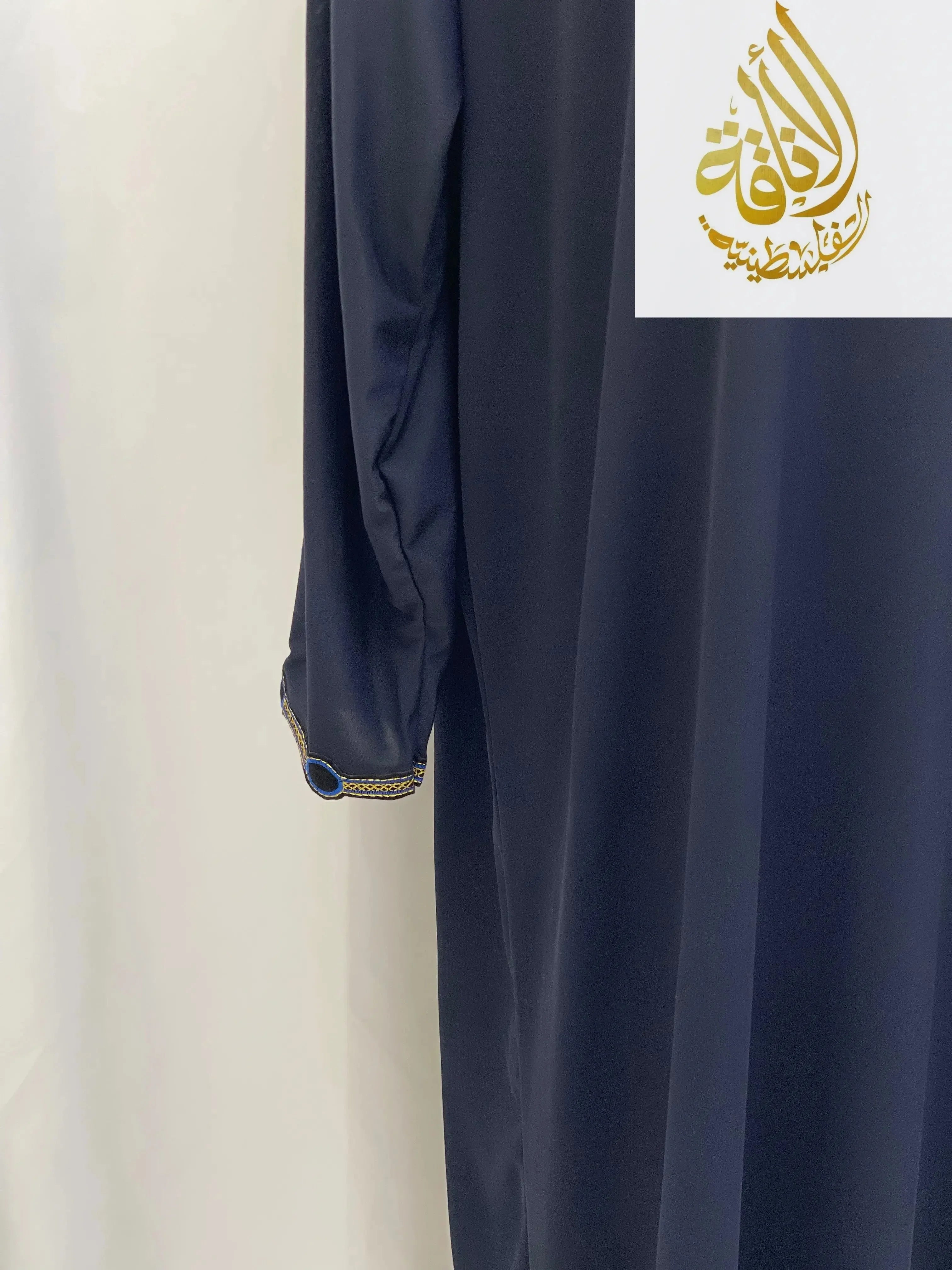 Navy blue comfortable one piece prayer dress with long sleeves and decorative cuff from Palestinian Elegance