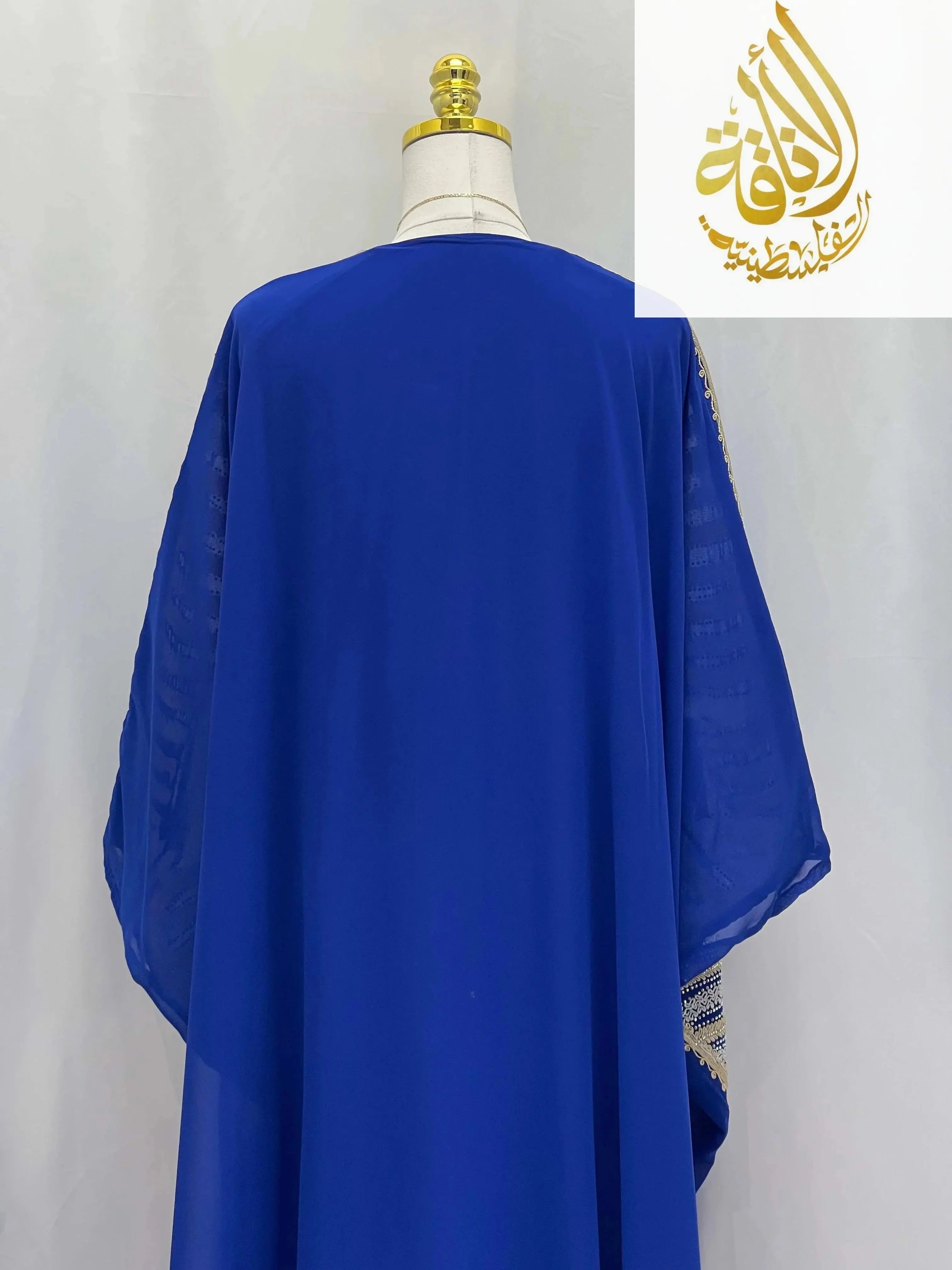 Back view of Dana Free Size Kaftan Abaya in royal blue by Palestinian Elegance with flowing fabric