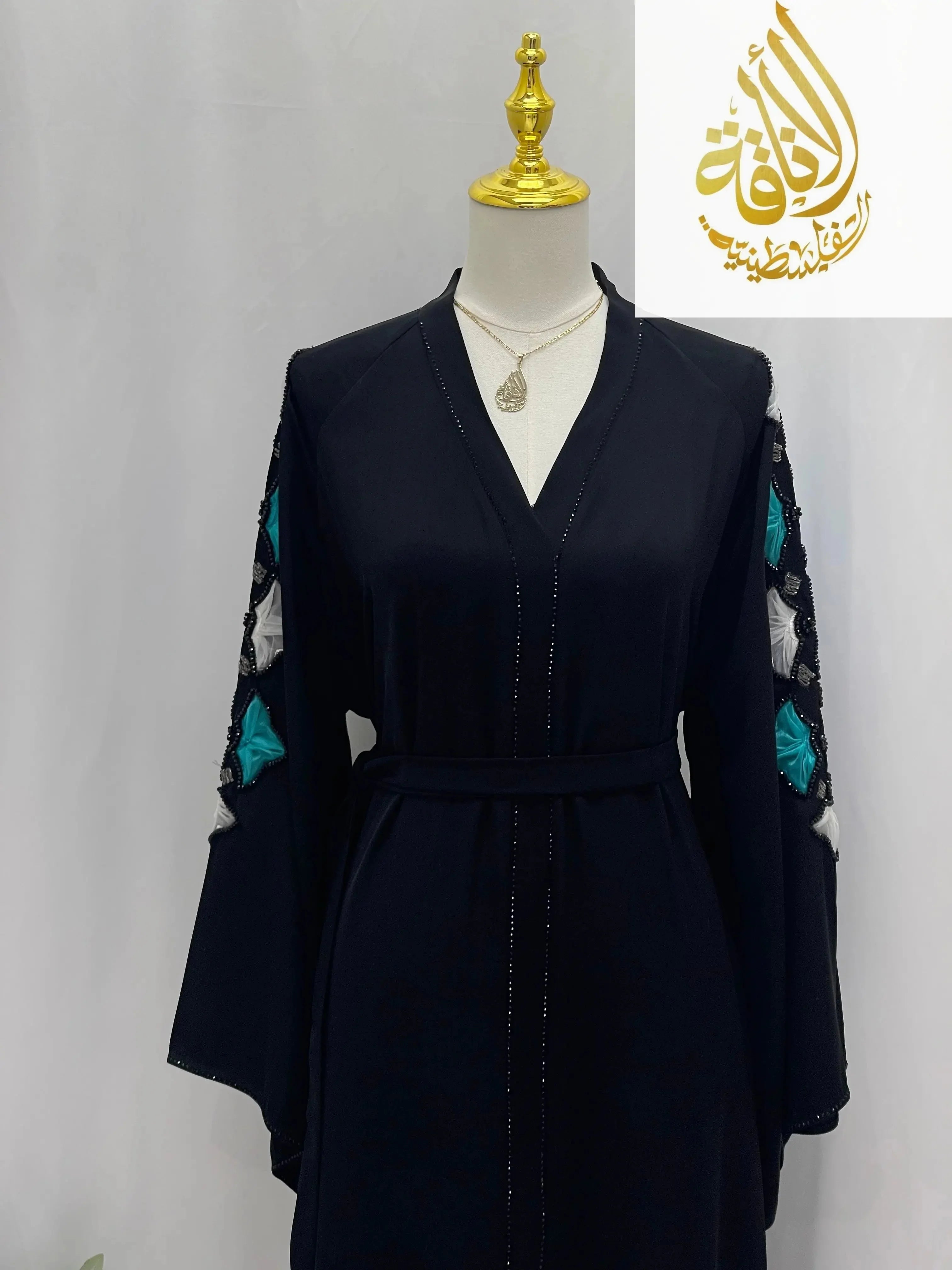 Palestinian Elegance elegant black abaya with teal and silver embroidery on sleeves and belted waist