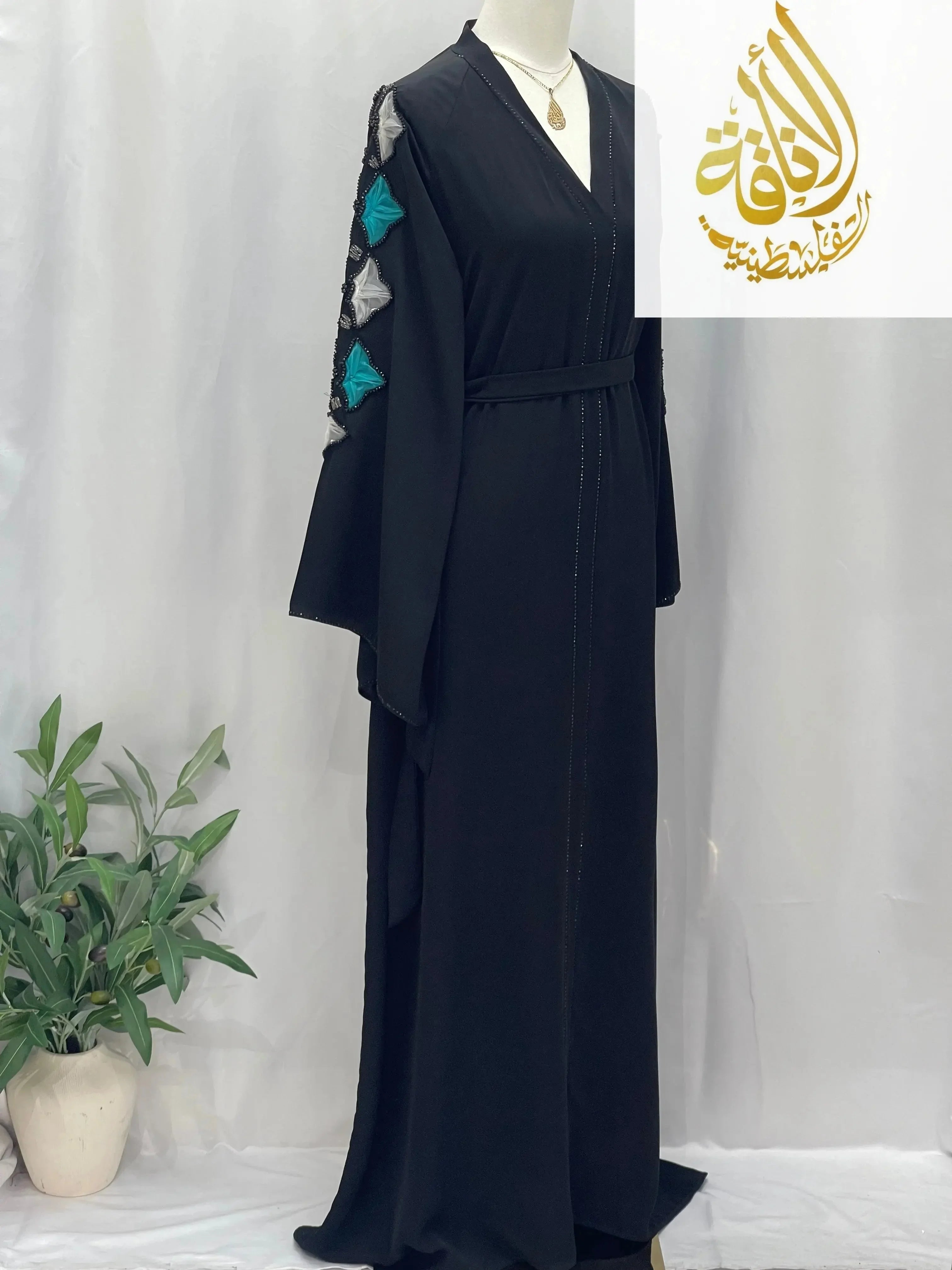 Palestinian Elegance elegant black abaya with embroidered sleeve details and waist belt