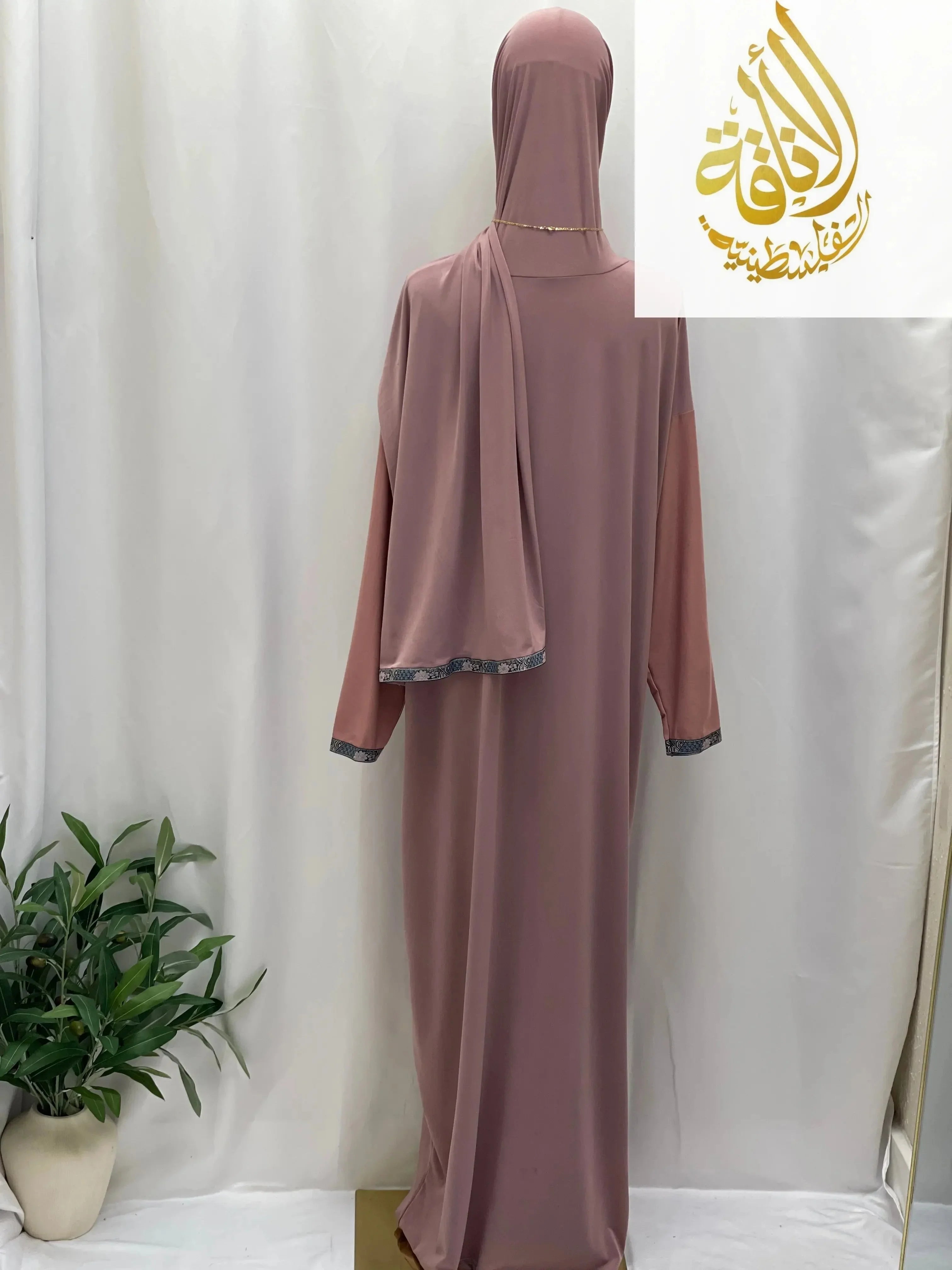 Palestinian Elegance one piece prayer dress in mauve with matching headscarf and decorative cuffs