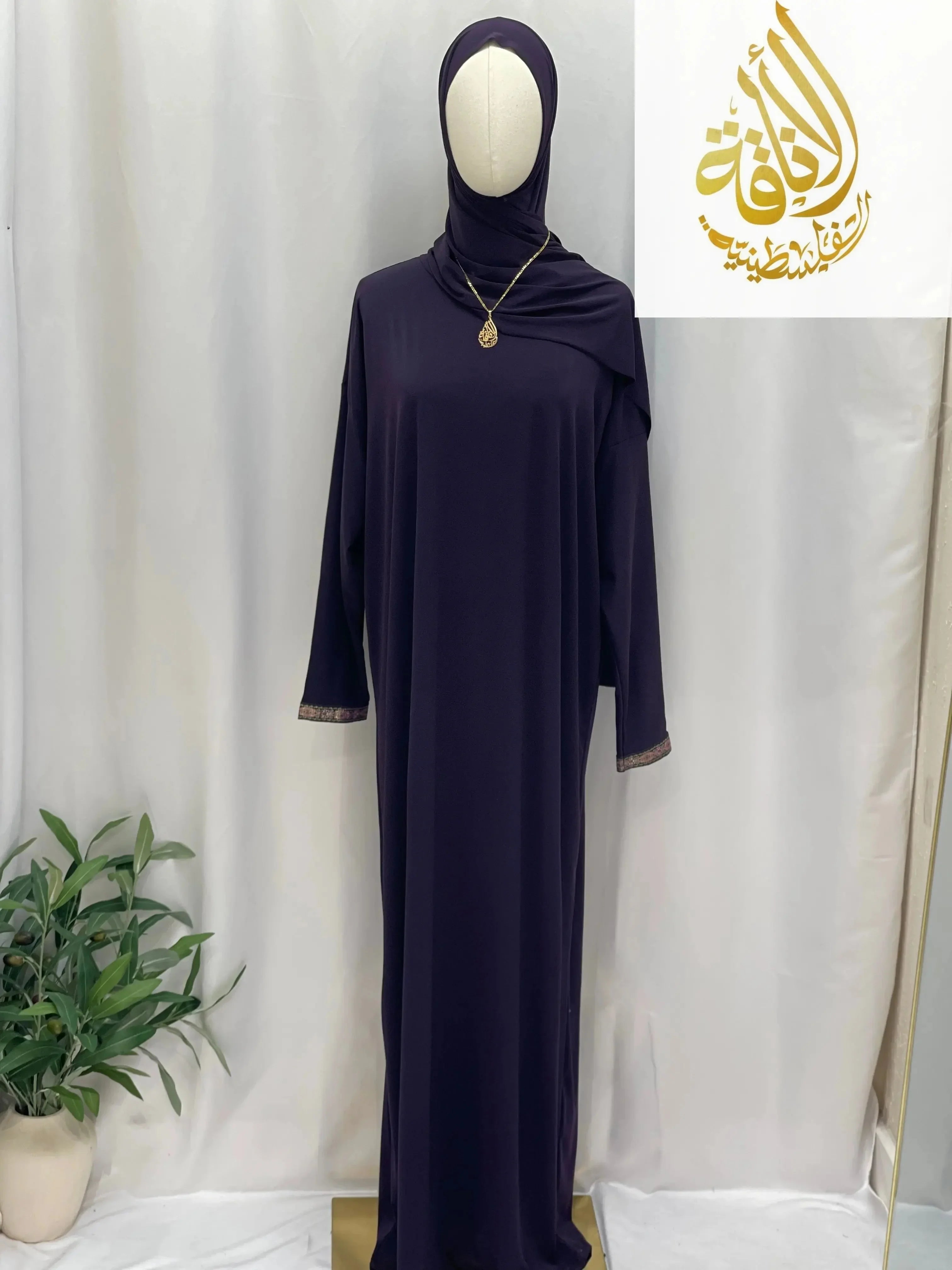 Palestinian Elegance one piece prayer dress in deep purple with long sleeves and modest design