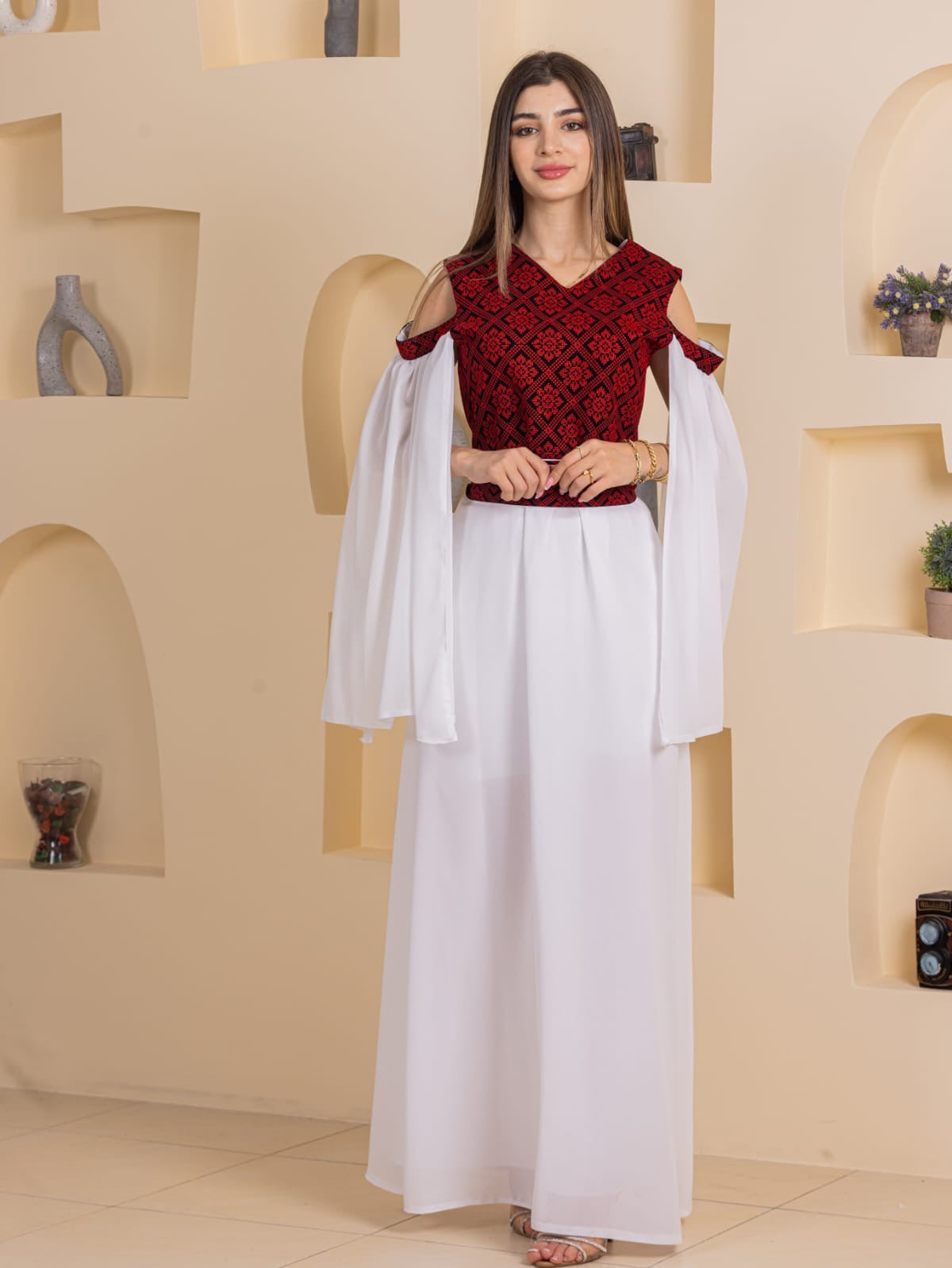 Palestinian Essence Dress by Palestinian Elegance red embroidered bodice with cold shoulder and flowing white skirt