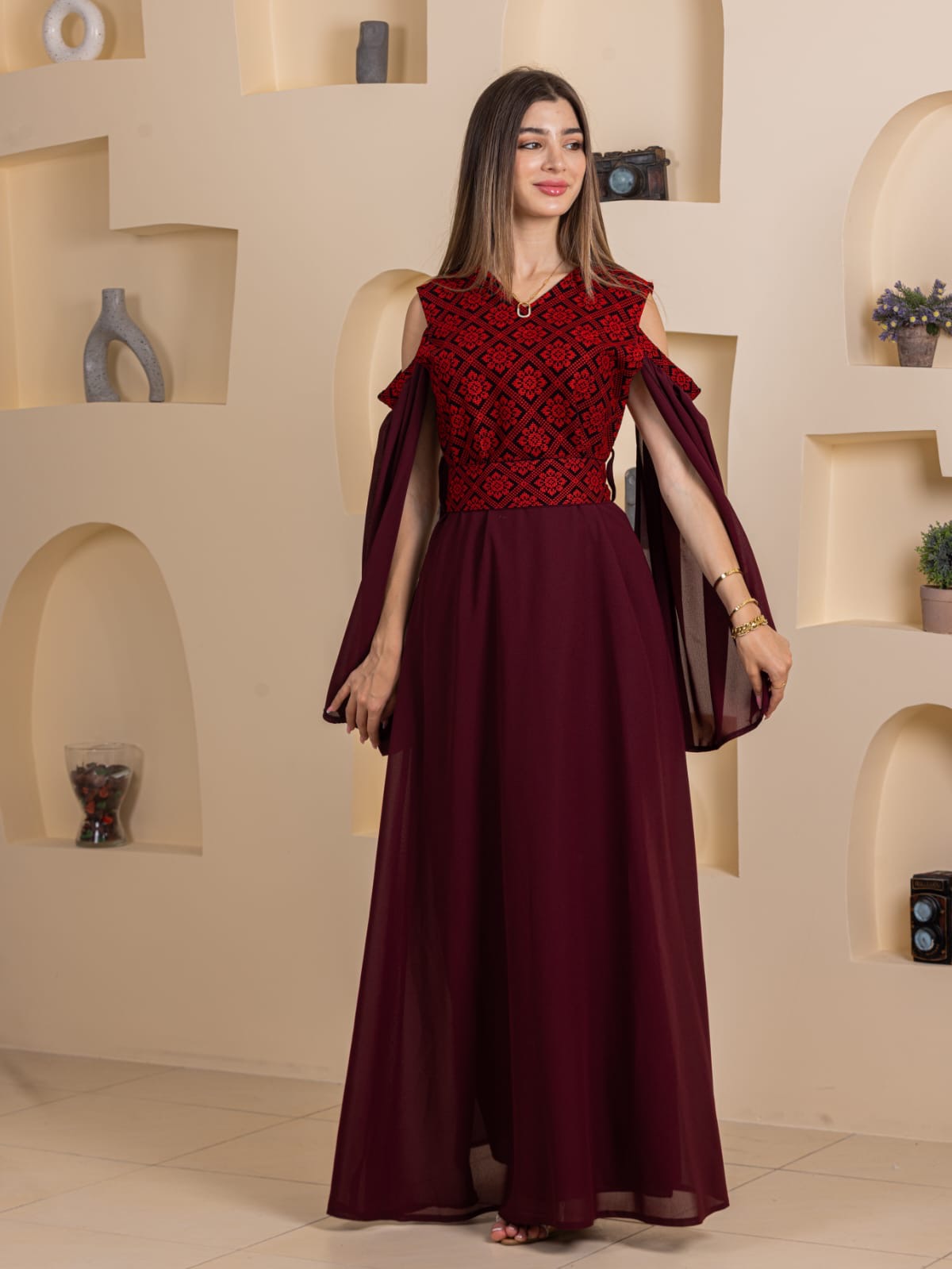 Palestinian Essence Dress . Maroon embroidered bodice gown with flowing chiffon skirt and cape sleeves by Palestinian Elegance