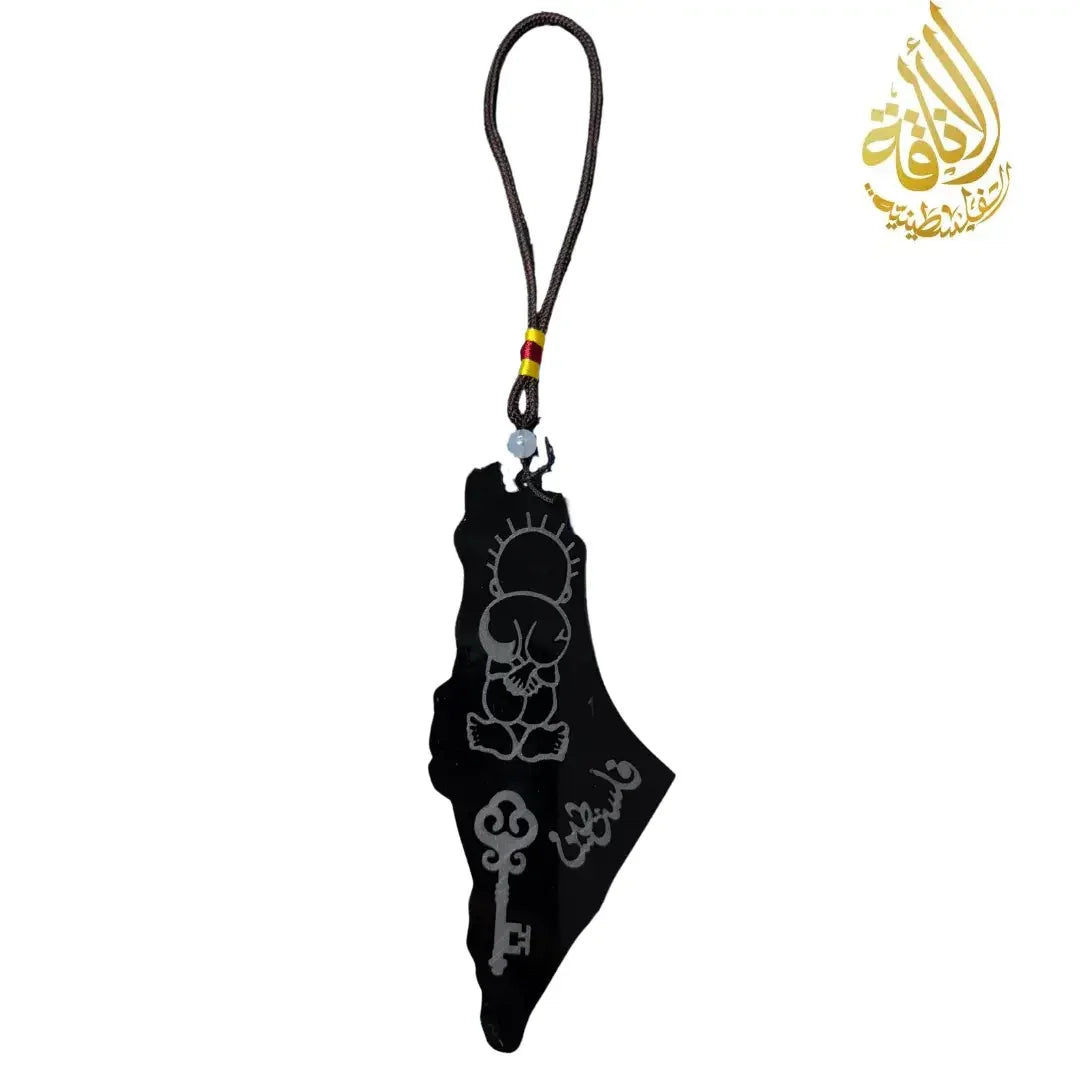 Palestinian heritage decor set featuring a black hanging ornament shaped like Palestine with traditional symbols