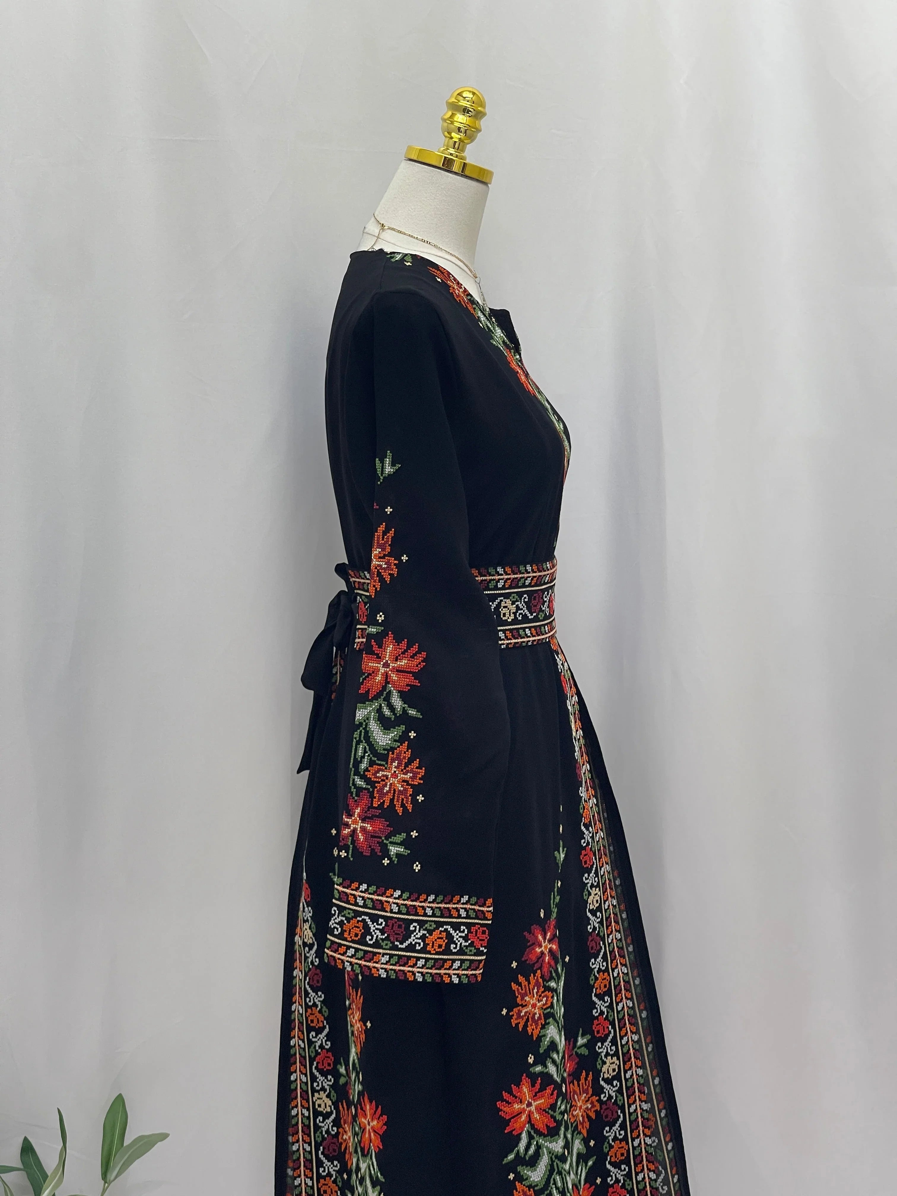Elegant Rose Embroidered Dress Abaya in black with vibrant floral embroidery and a tied waist